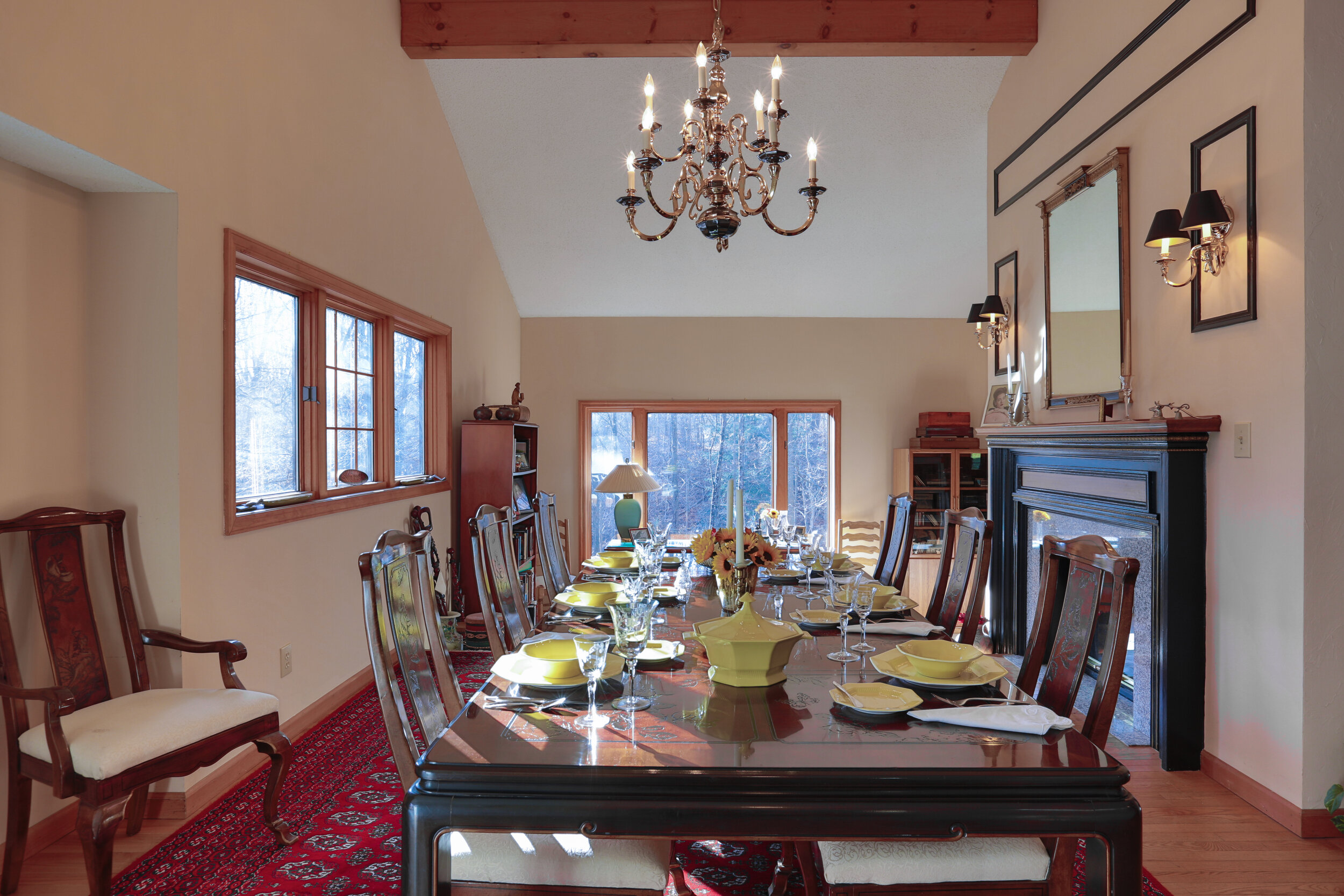  Dining room showing table set with bowls and plates. 