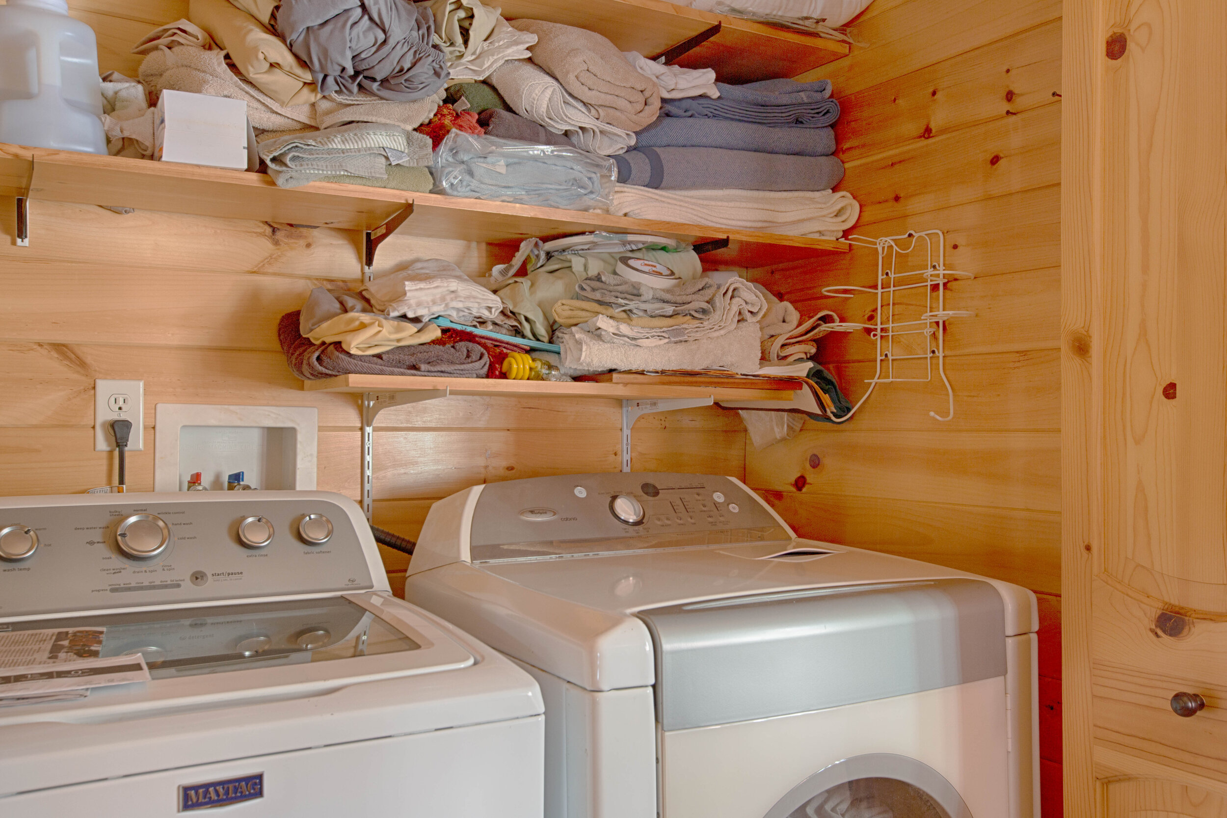 laundry room with two washing machine