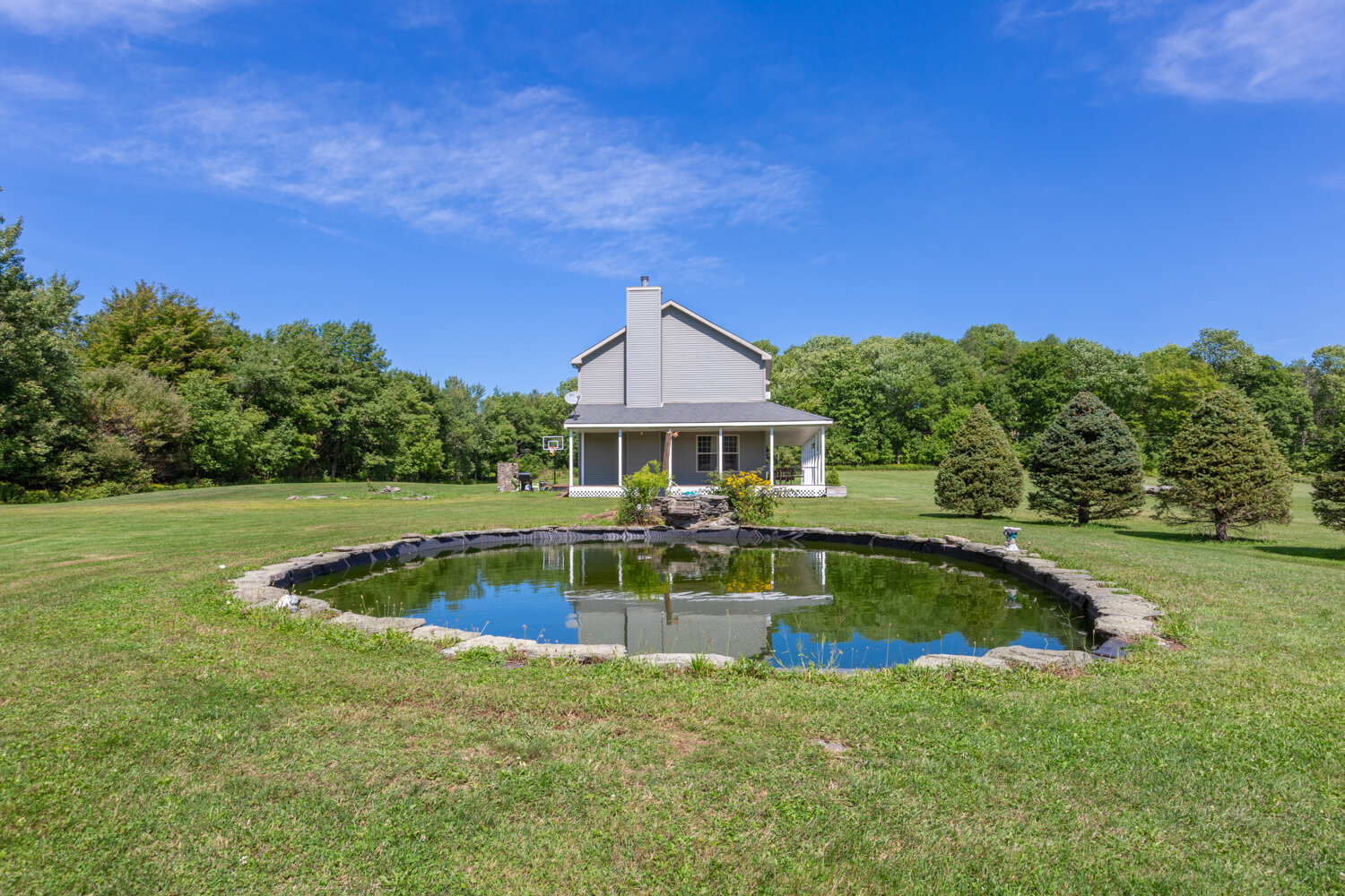 view of the house showing the pond