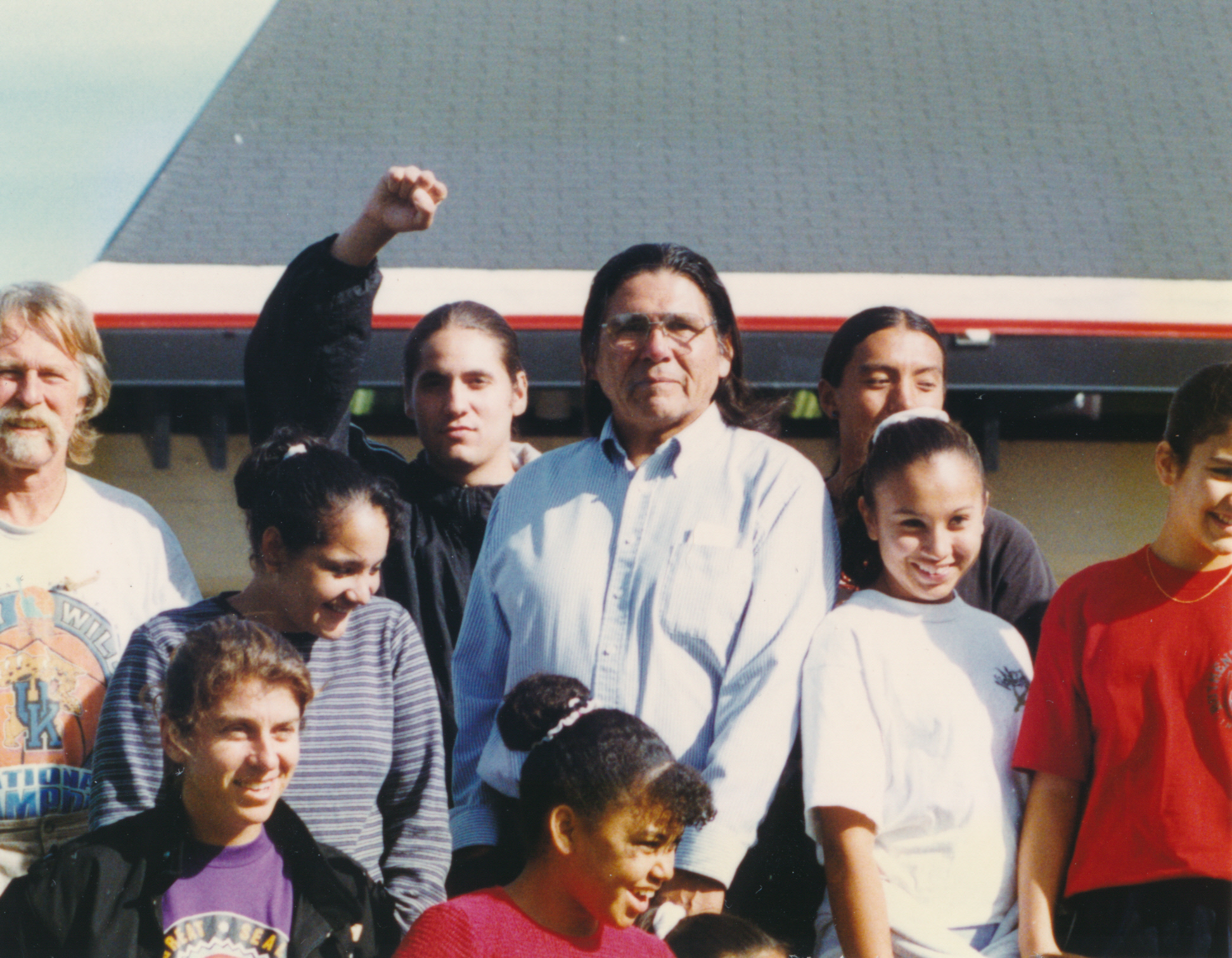  Dennis & runners. Anyone recognize anyone in this photo or this long house in the background? I would love for that community to have this photo