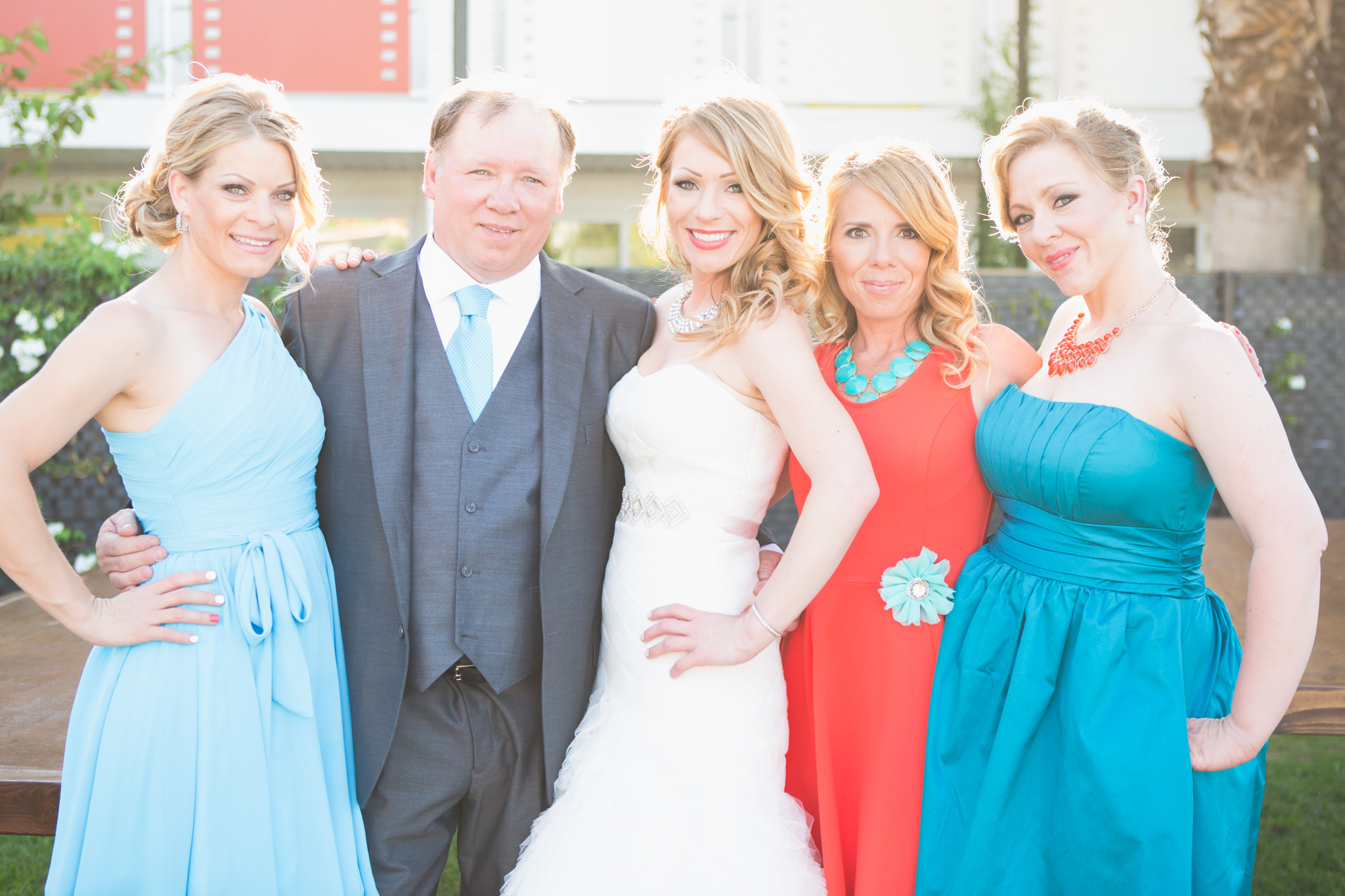 scottsdale-wedding-photographer-el-dorado-bride-sisters-father-colorful-backlight