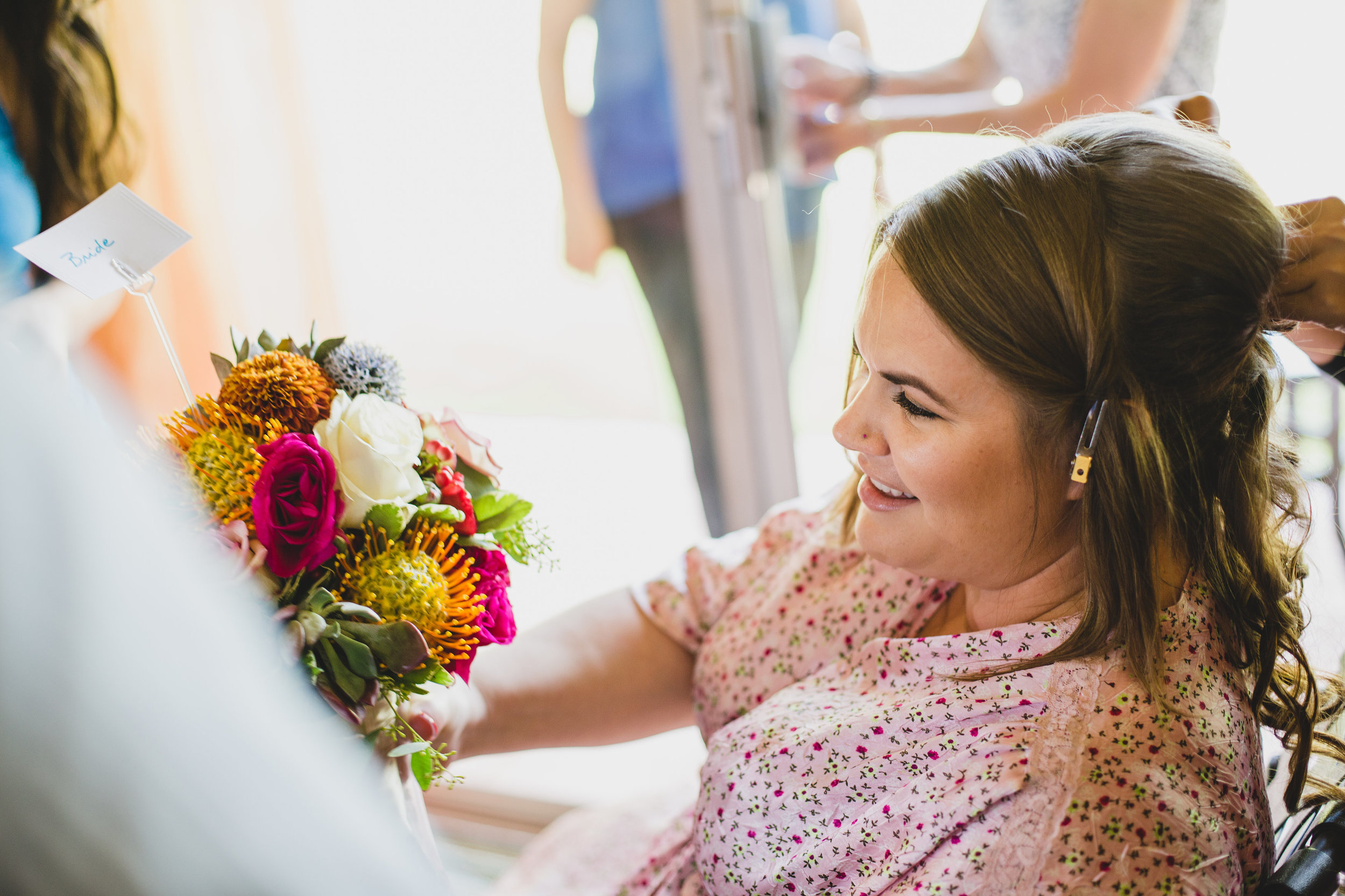 wedding-photographer-bride-checking-out-bouquet