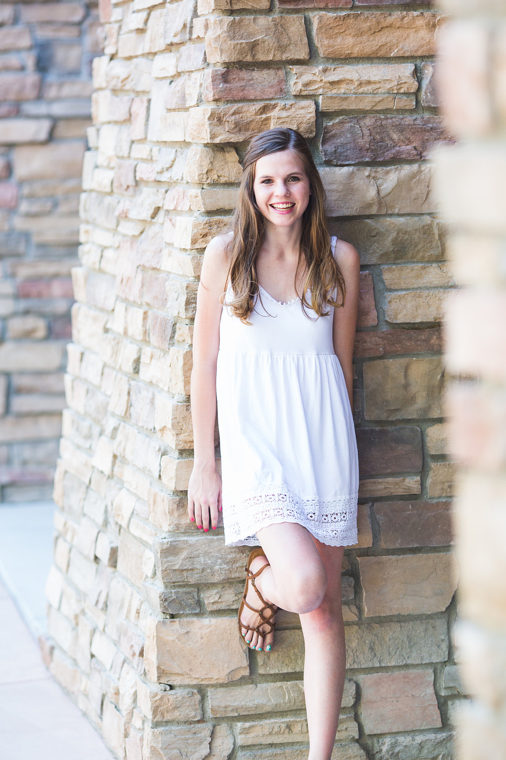 senior-photography-ccv-amber-leaning-rock-wall
