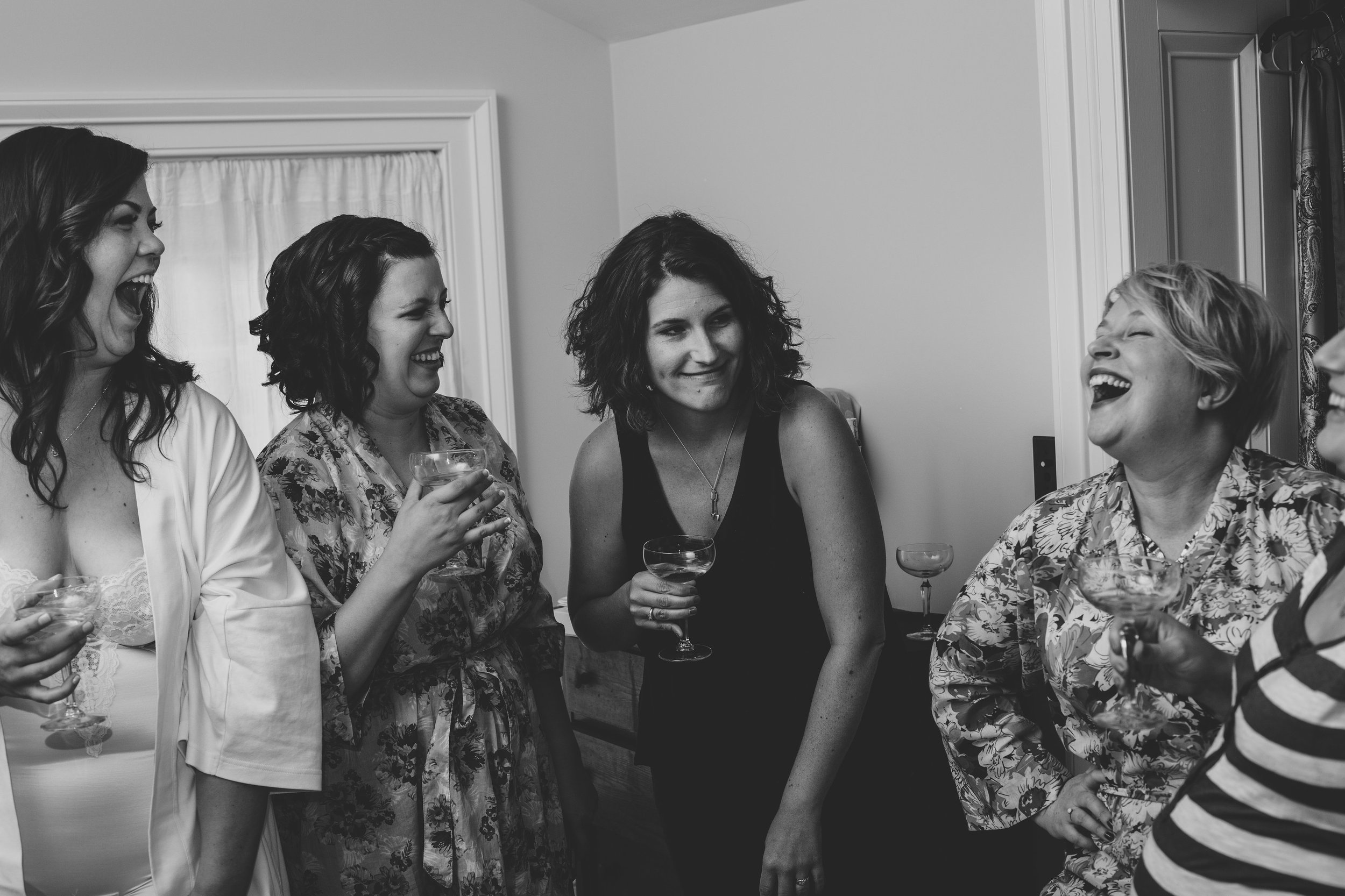 bridesmaids-laughing-after-toast-ny