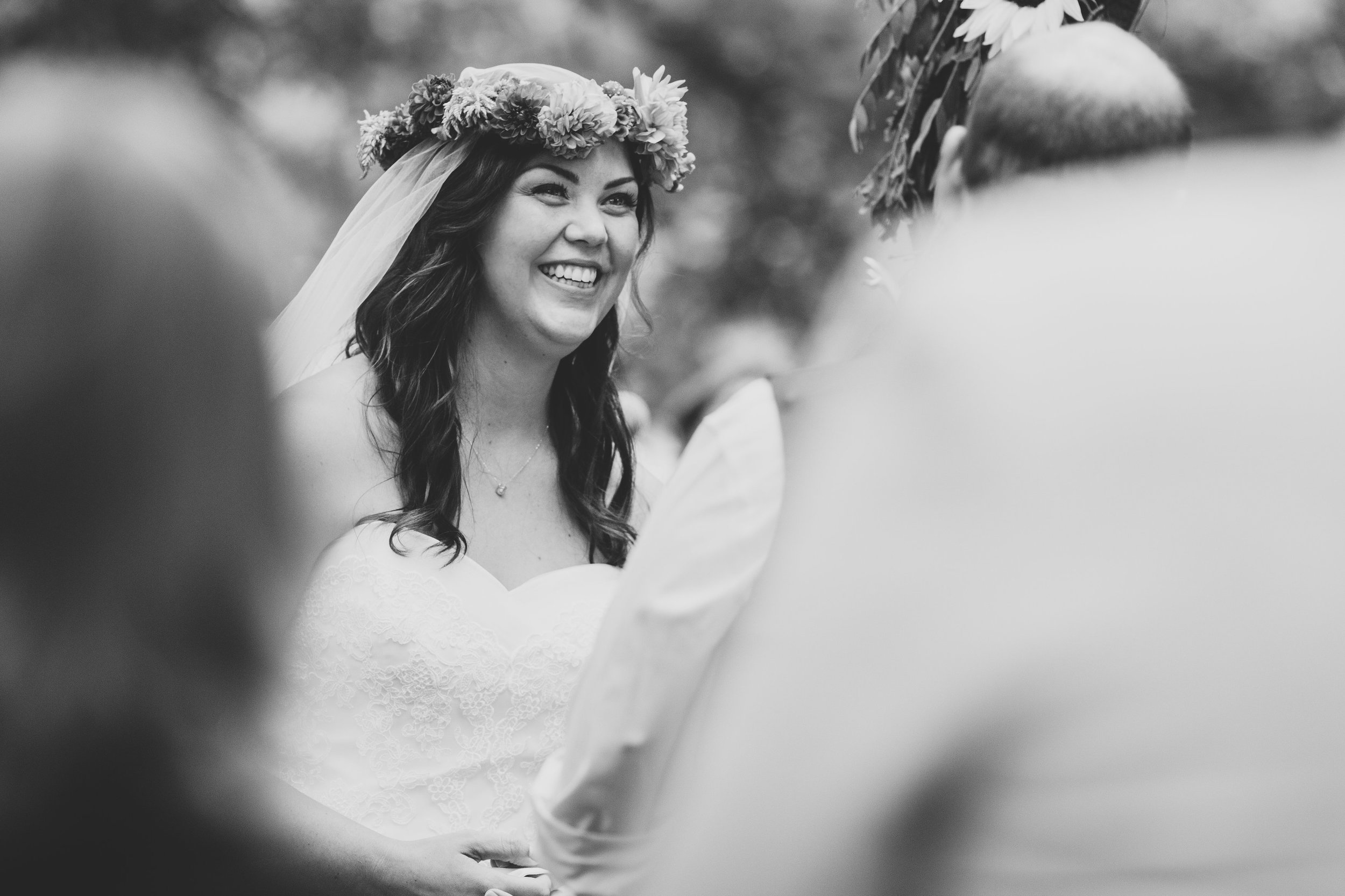 black-and-white-bride-smiling-during-ceremony-tiffany