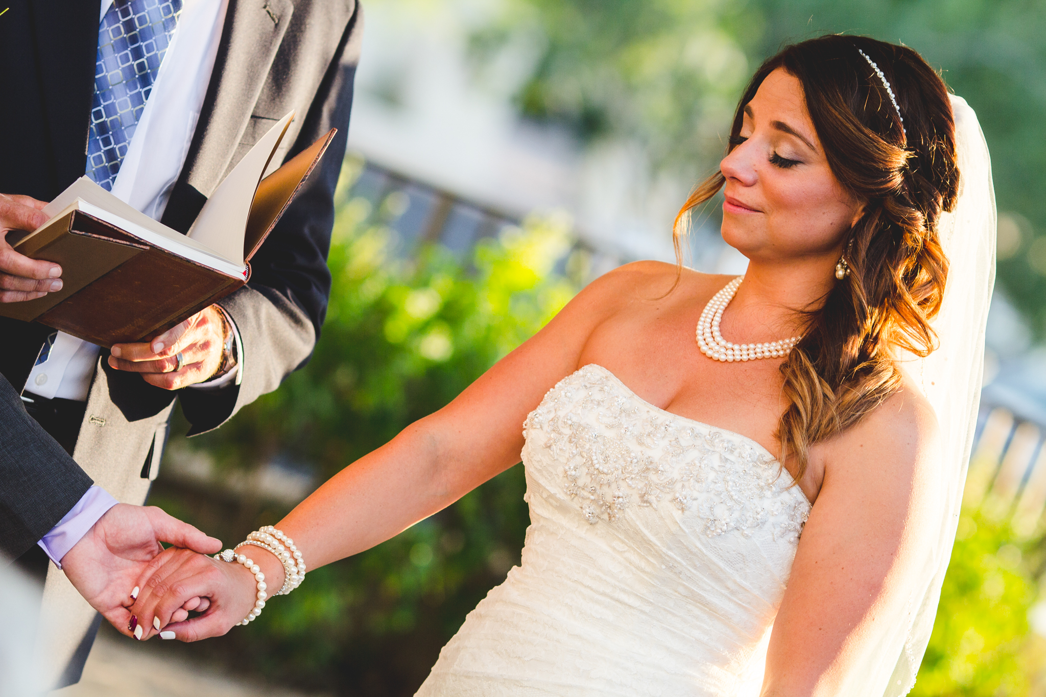 lori bride takes grooms hand
