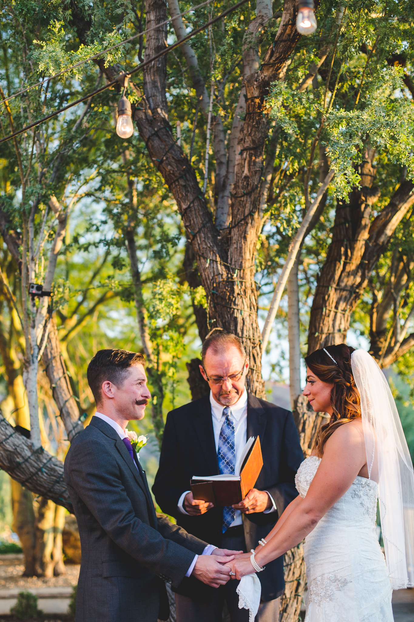 camelback inn wedding bride and groom hand in hand ceremony lc