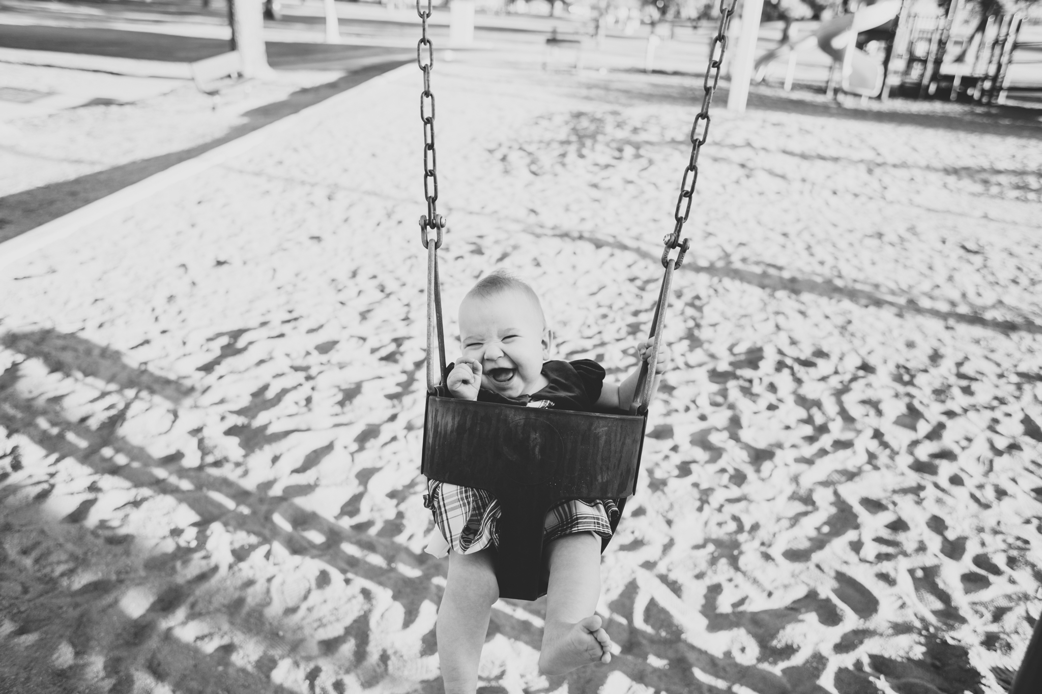 cute baby on the swings at the park az amelia