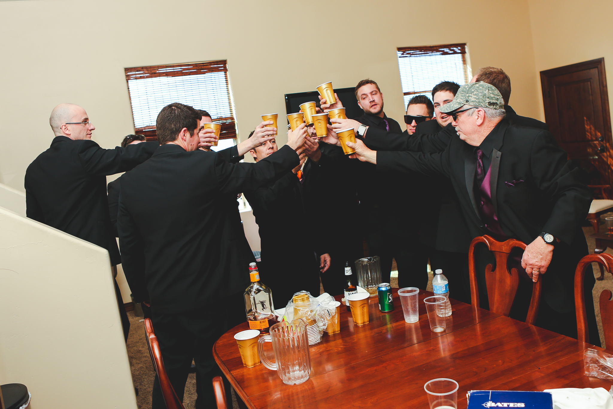groom and groomsmen have a getting ready toast mj