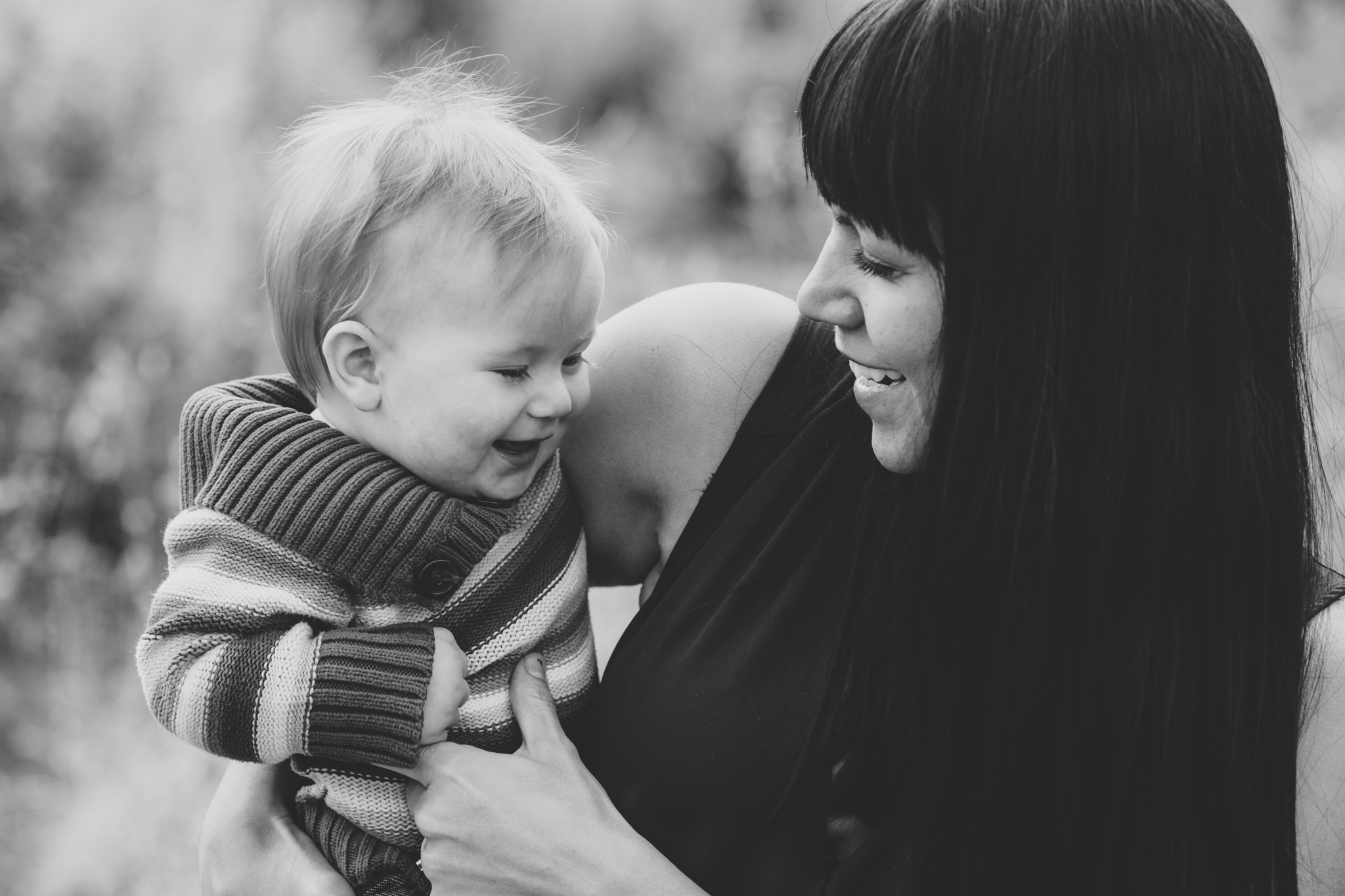 ball black and white mother son laughing photo