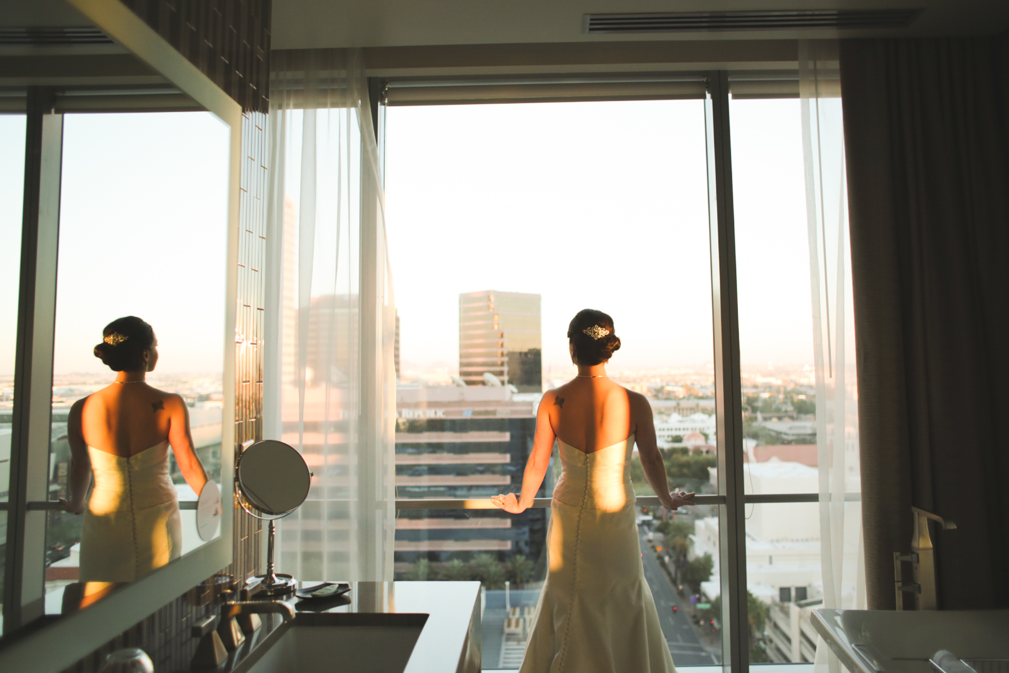 bride looks out from building at sunset downtown phoenix hj