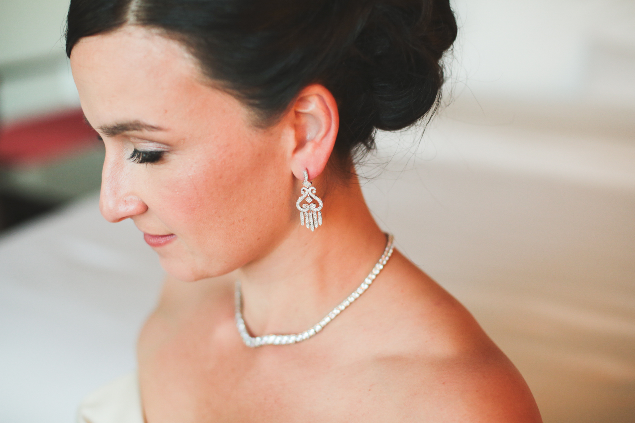beautiful bride and her jewelry on and ready to go hj