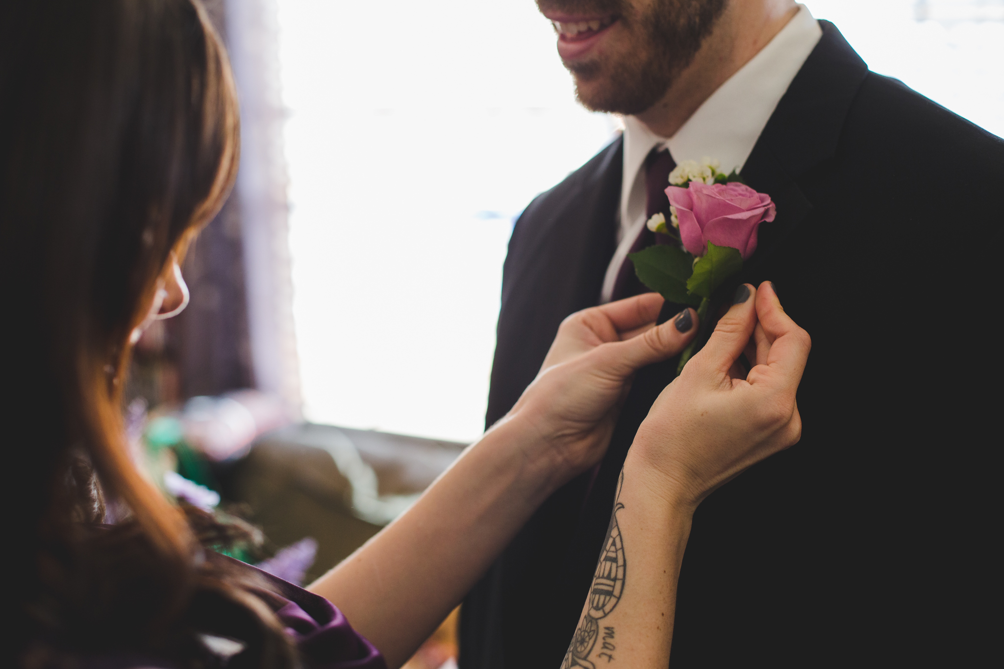 groomsmen gets his boutonniere sd