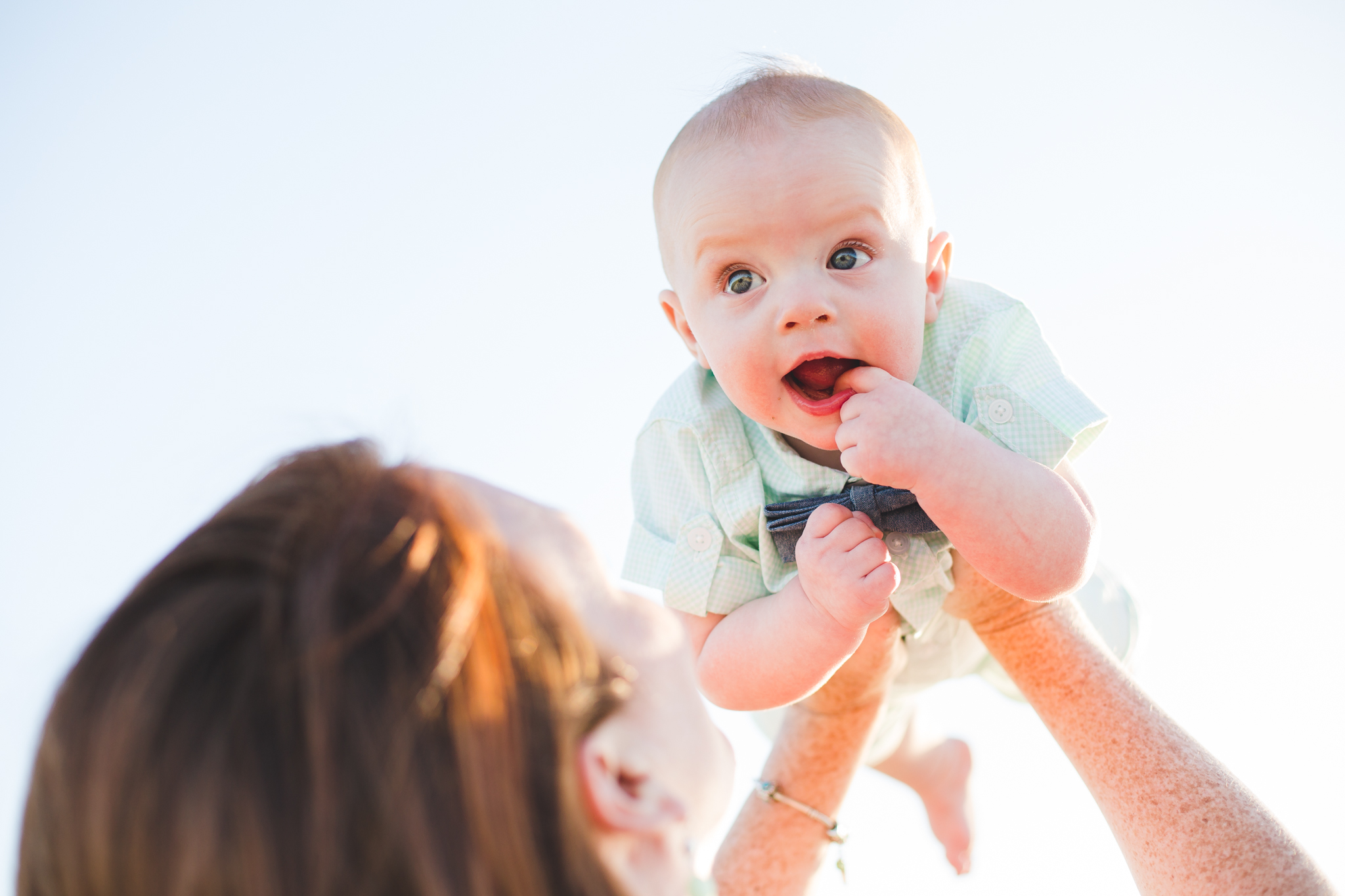 aaron kes photography super cute baby held up by mom