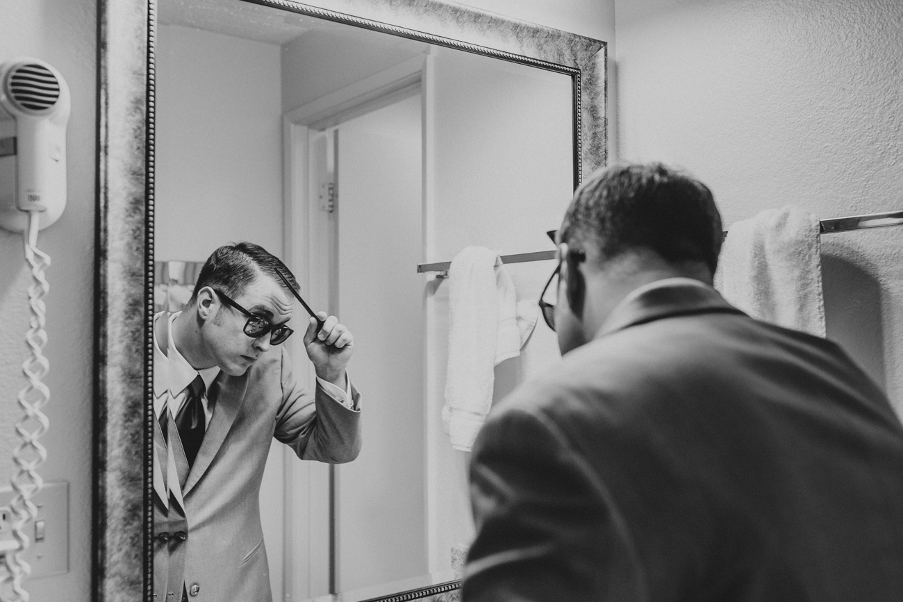 groom-getting-ready-in-mirror