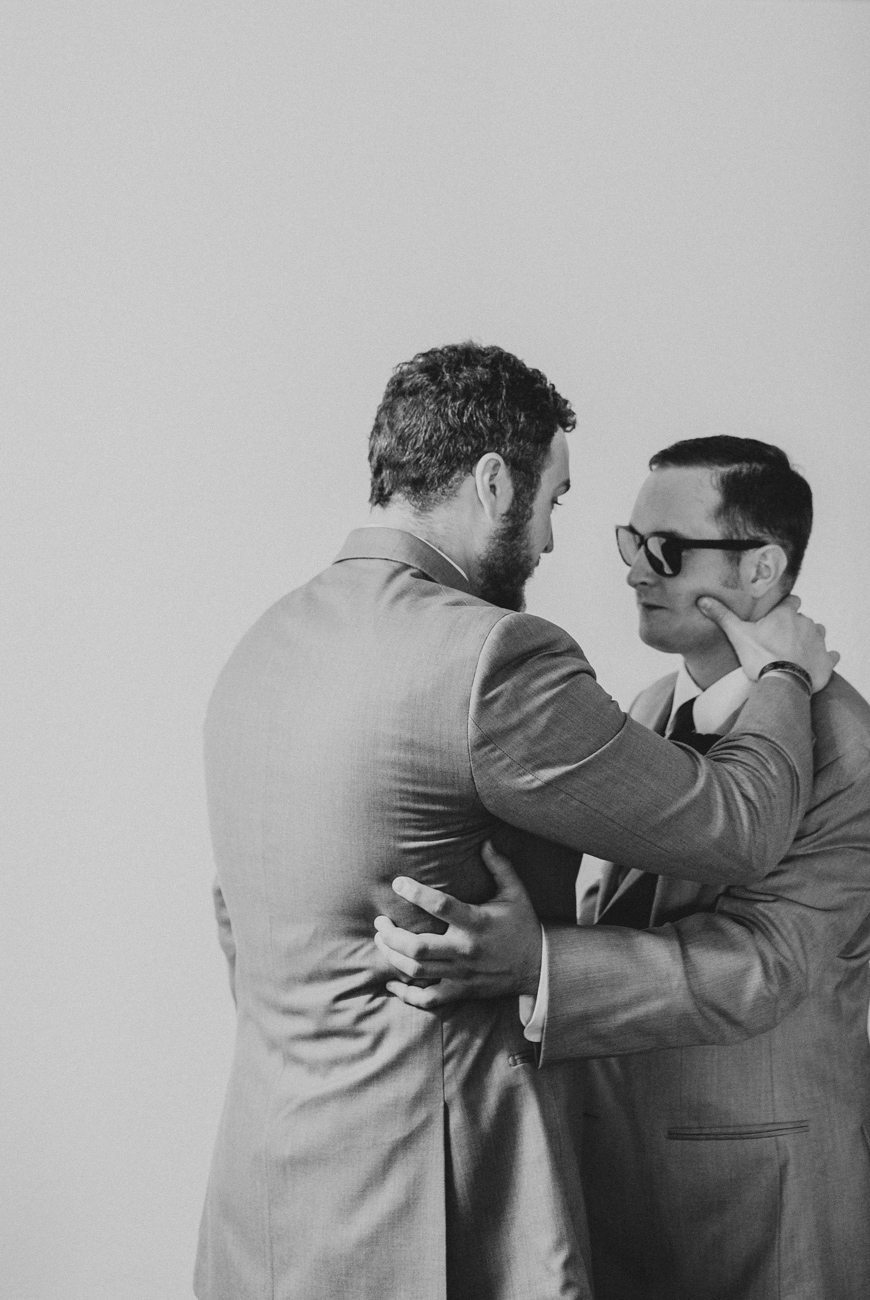 groom-and-best-man-sharing-moment