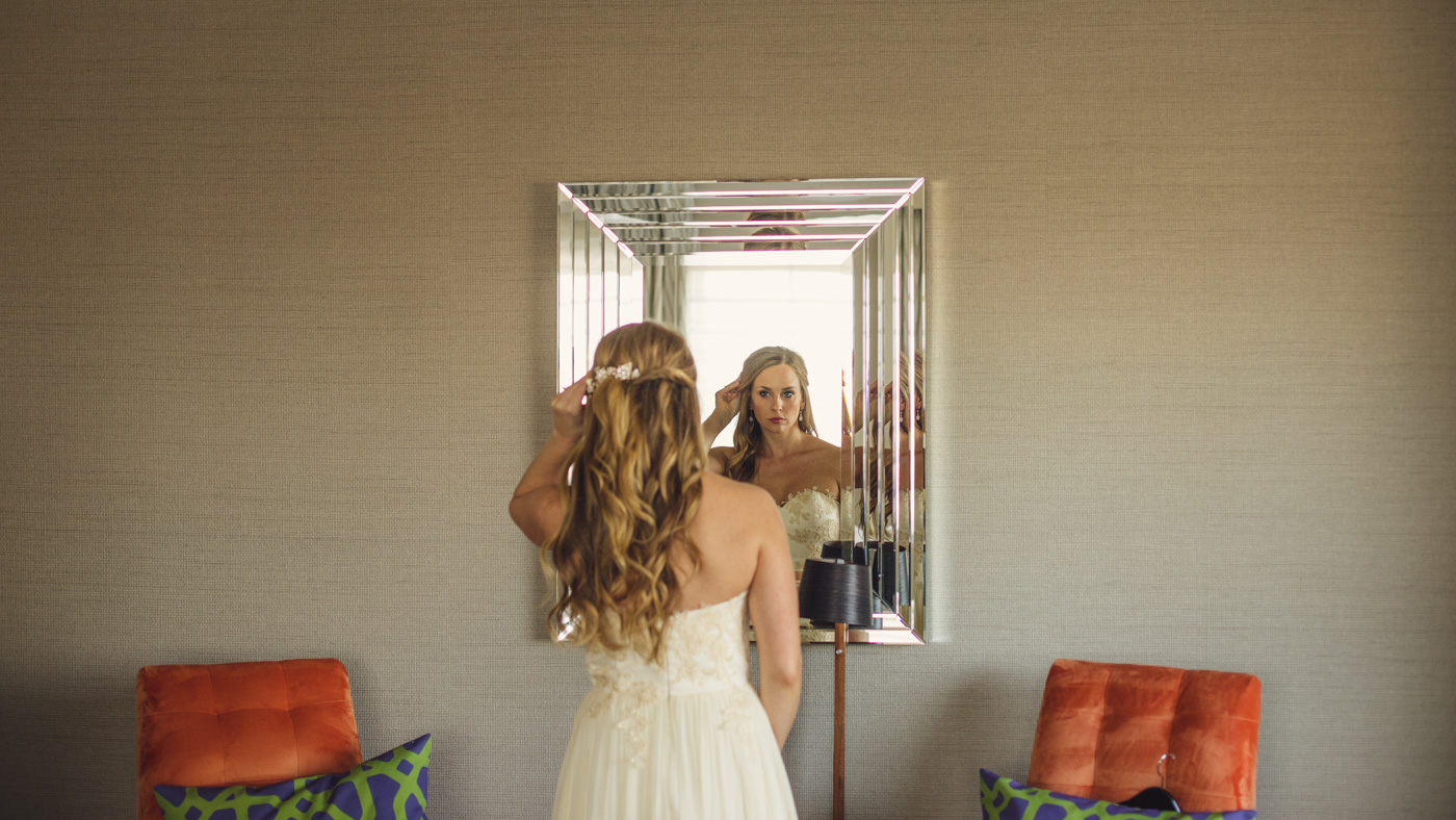 bride-checking-hair-getting-ready-hotel-palomar
