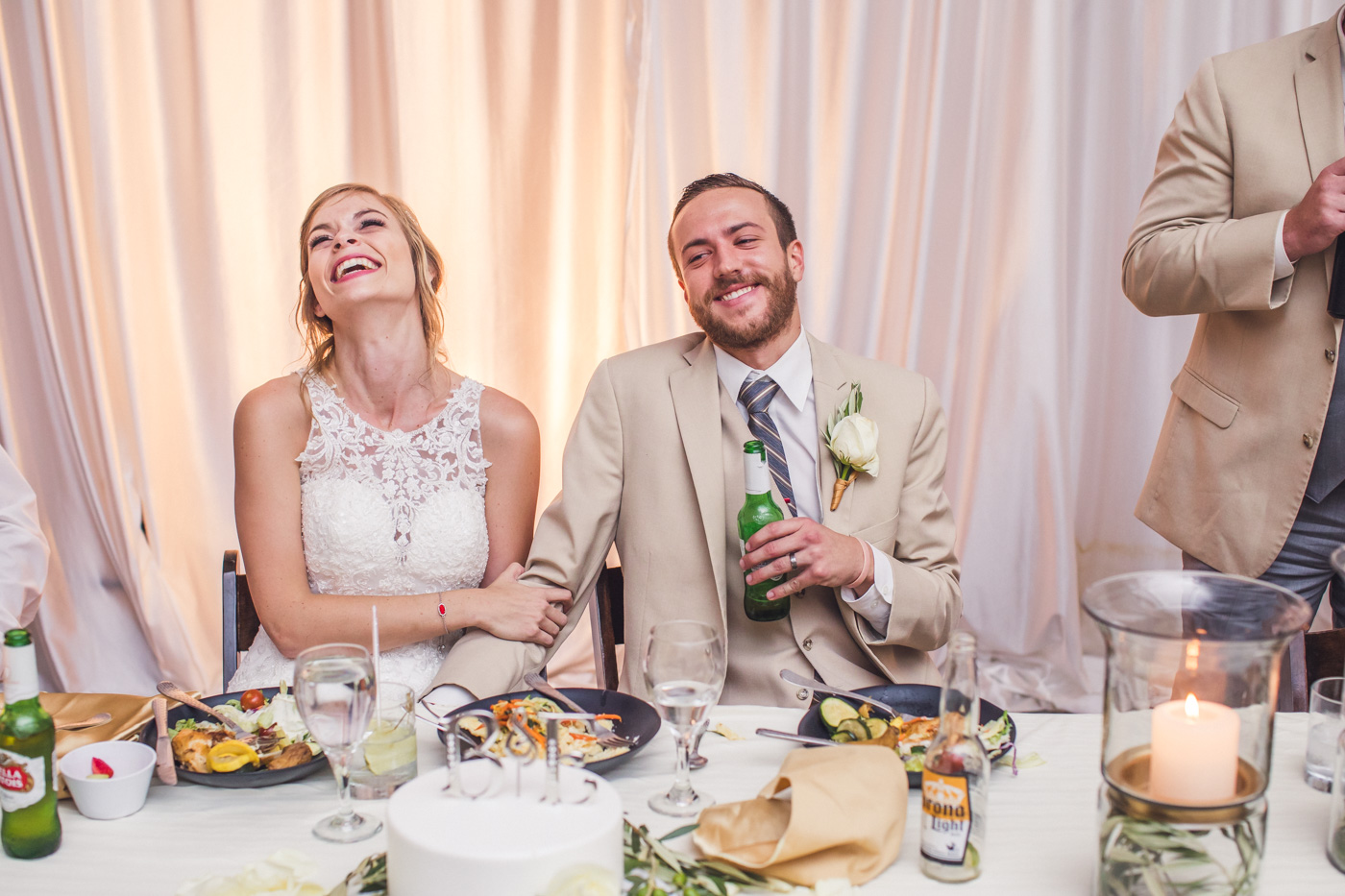 groom-laughing-wedding-reception