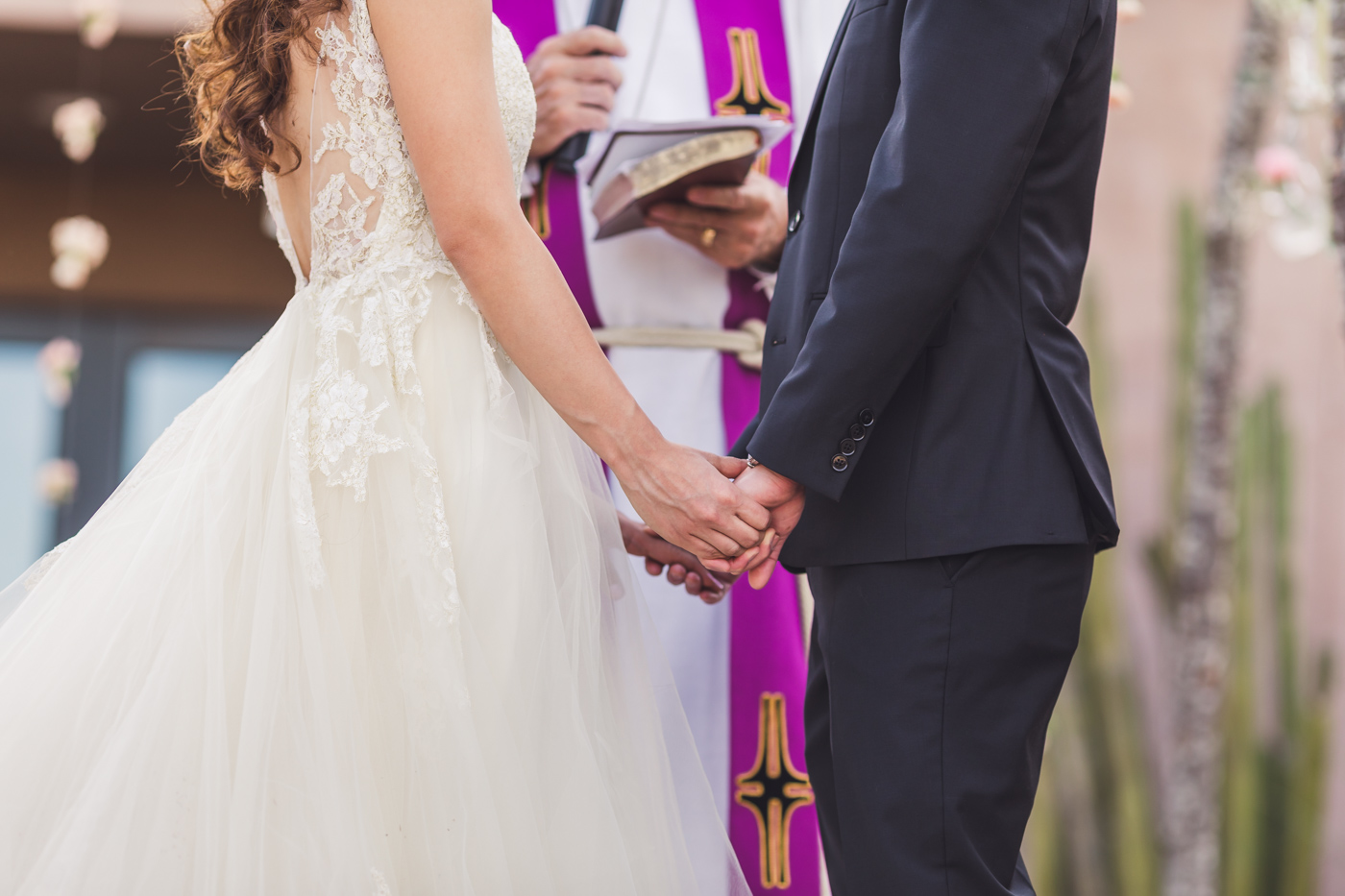 holding-hands-at-wedding-ceremony