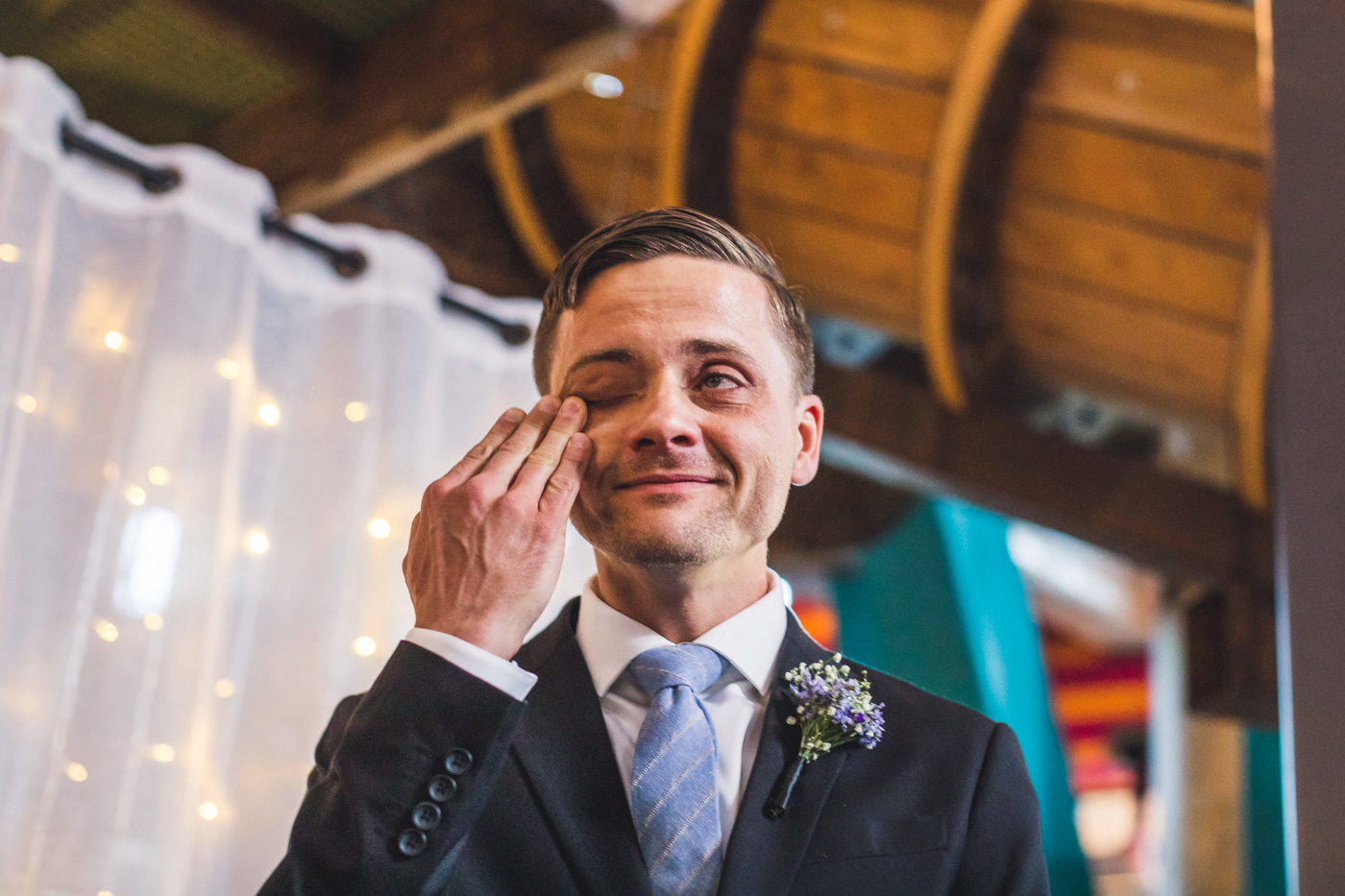 groom-getting-teary-at-wedding-ceremony