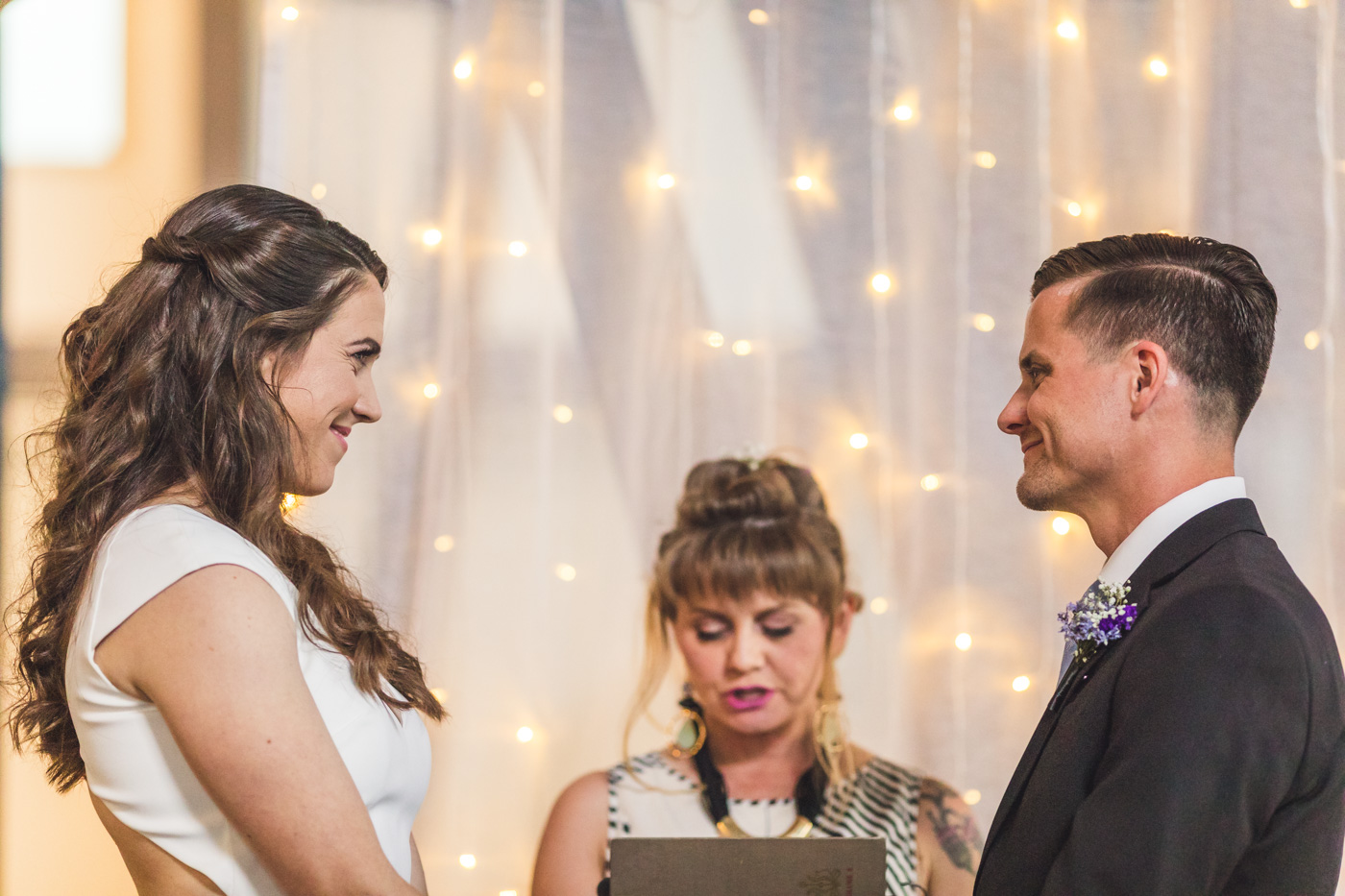 bride-and-groom-smiling-at-wedding-ceremony