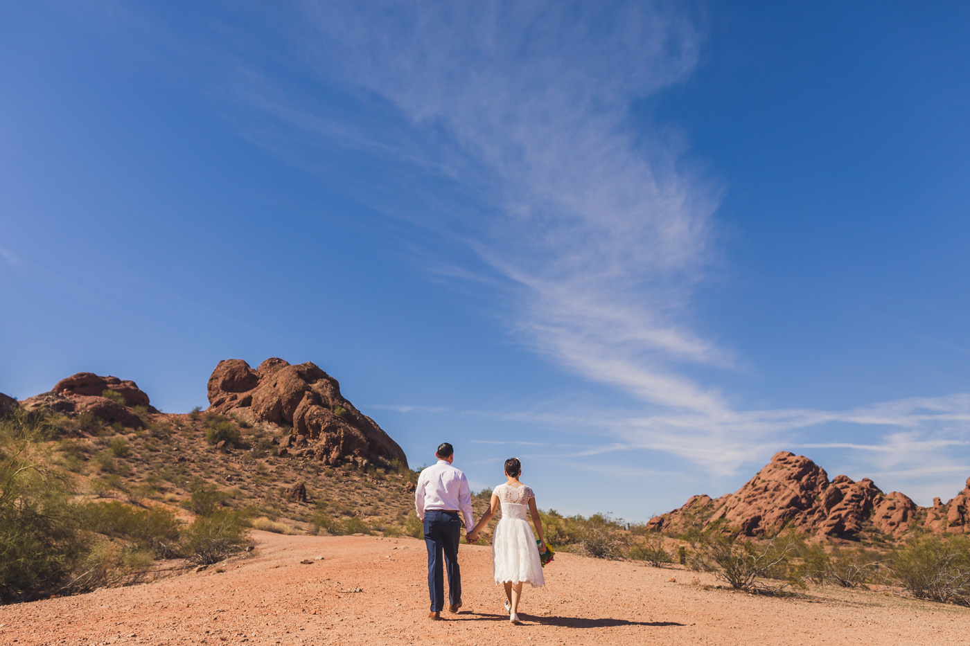 ruby-and-cristian-walking-in-papago-park