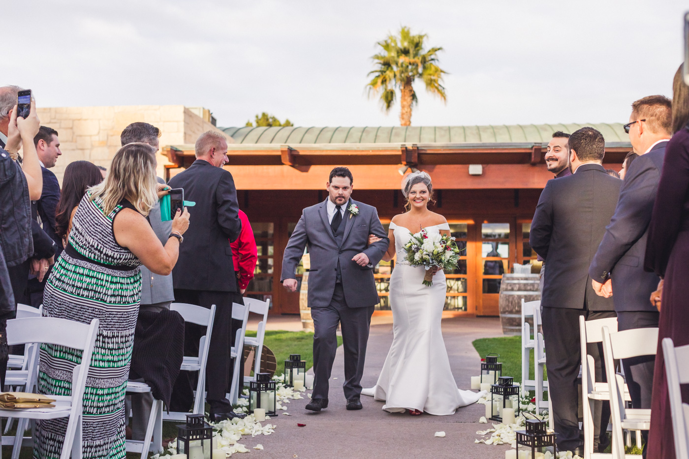 bride-walks-down-aisle-wedgewood-ocotillo-wedding