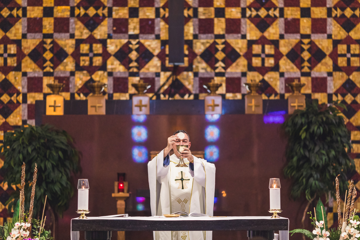 priest-blesses-eucharist