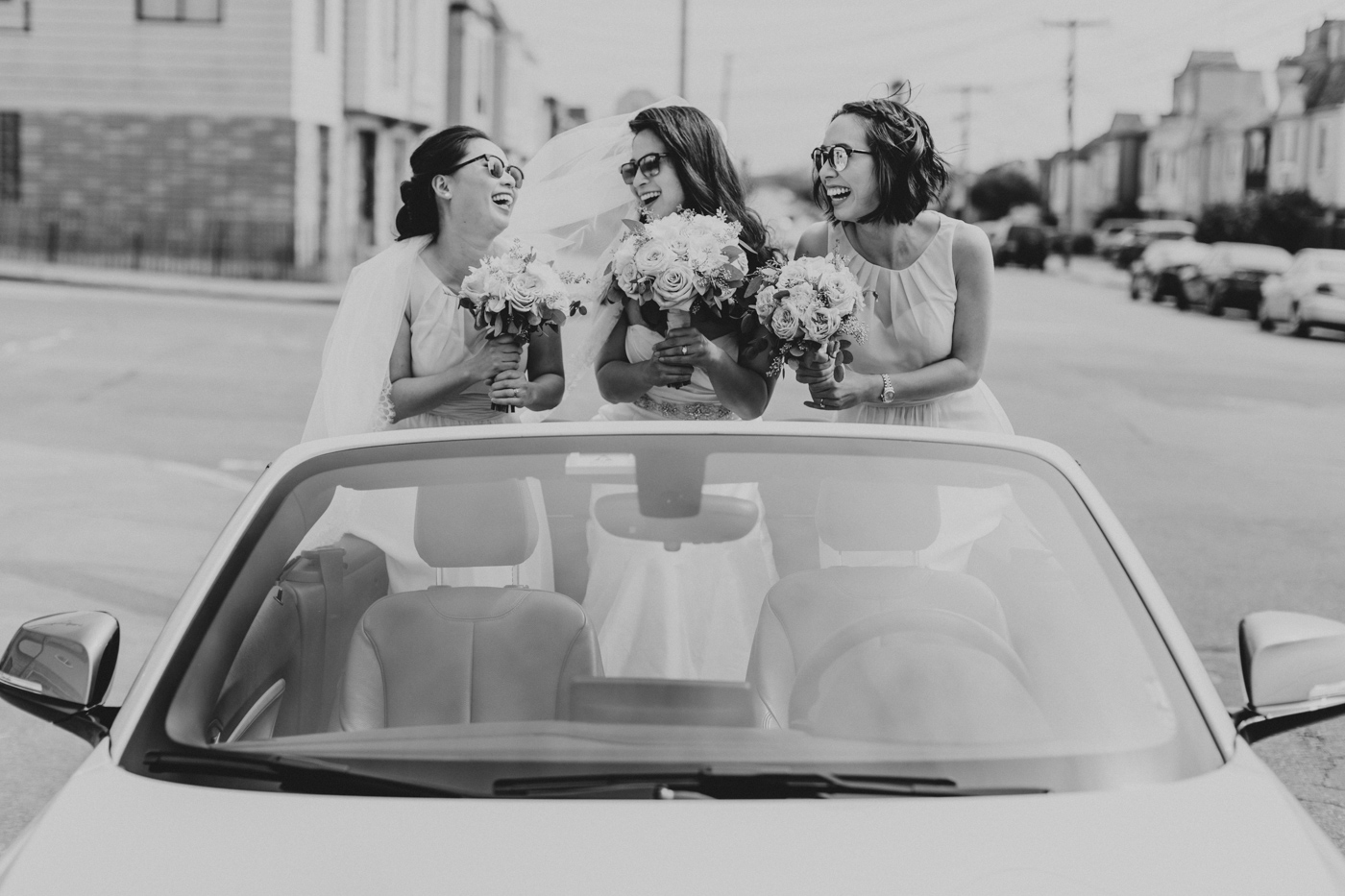 bride-and-bridesmaids-in-convertible