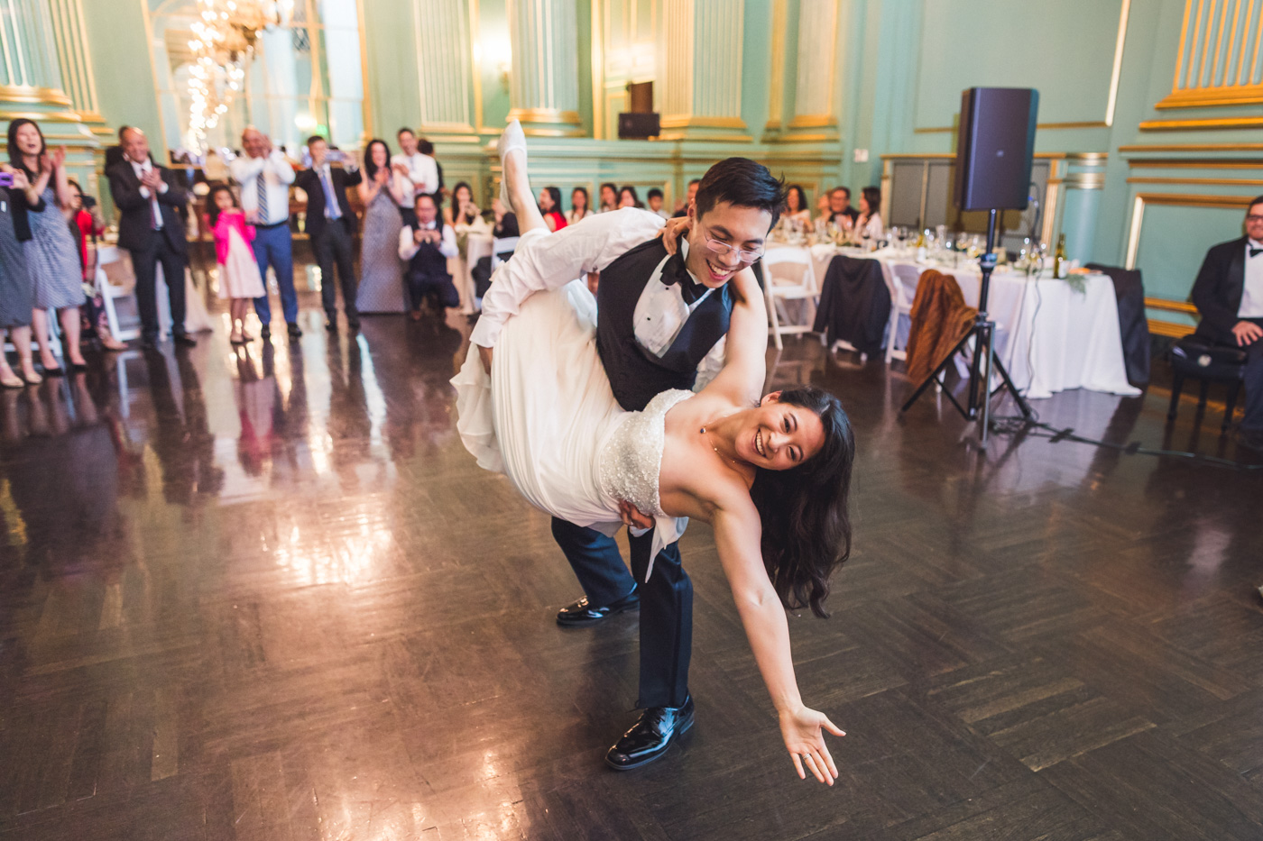groom-dips-bride-first-dance-green-room-wedding-reception