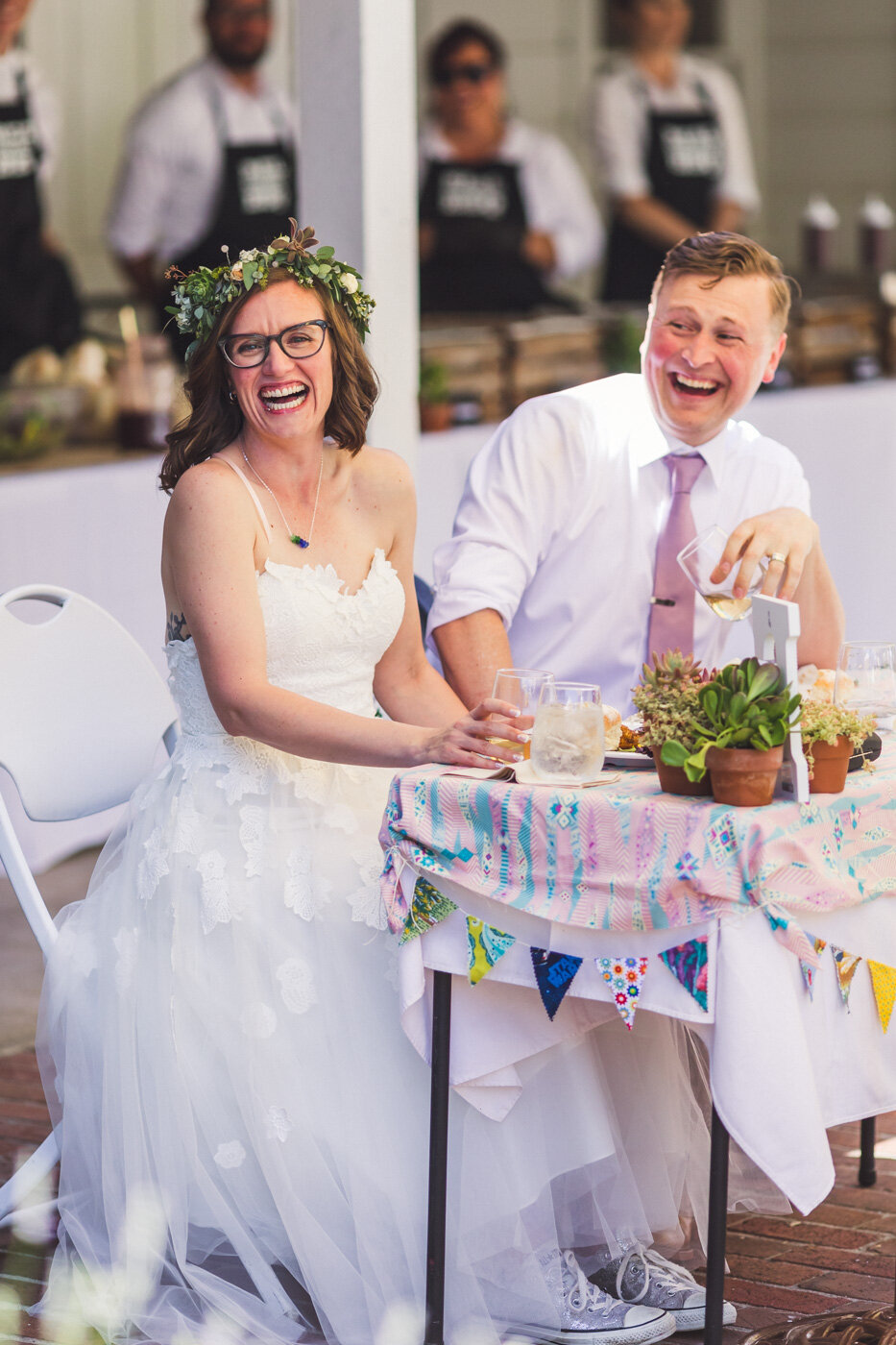 bride-and-groom-laughing-during-speeches