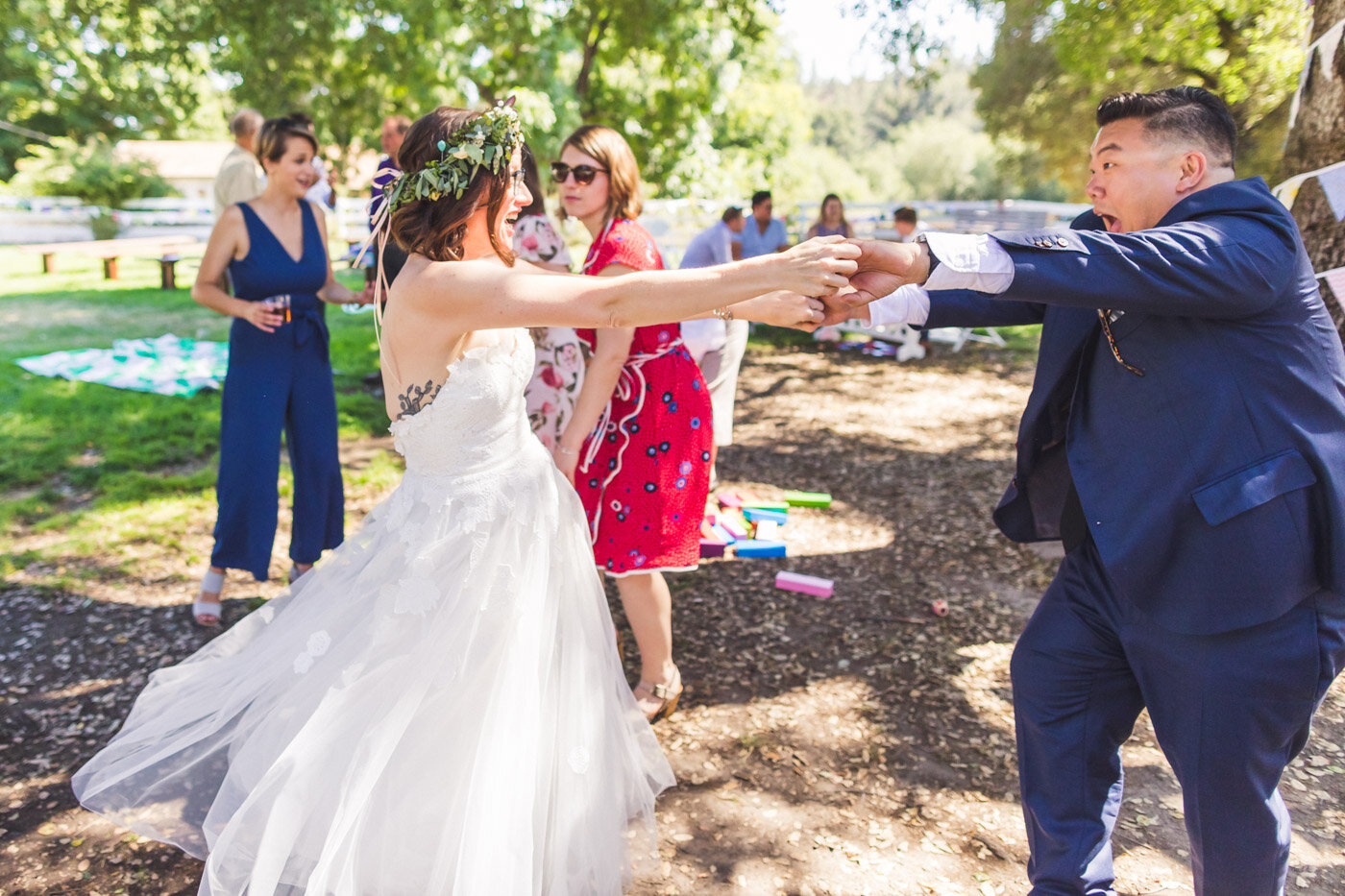 bride-getting-twirled-by-wedding-guest