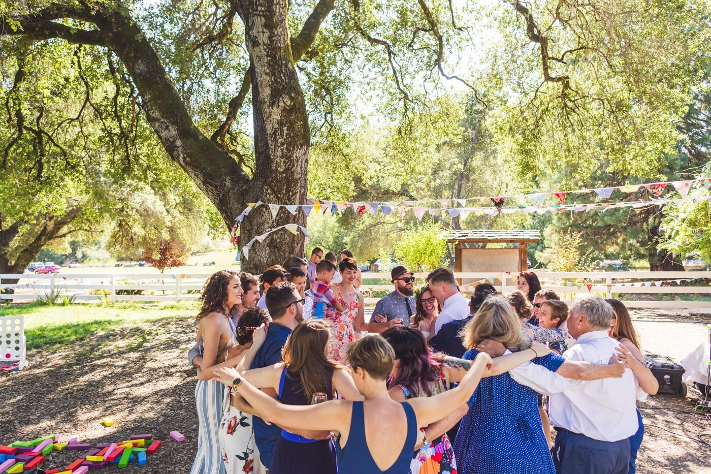 friends-and-family-surround-bride-and-groom-dancing