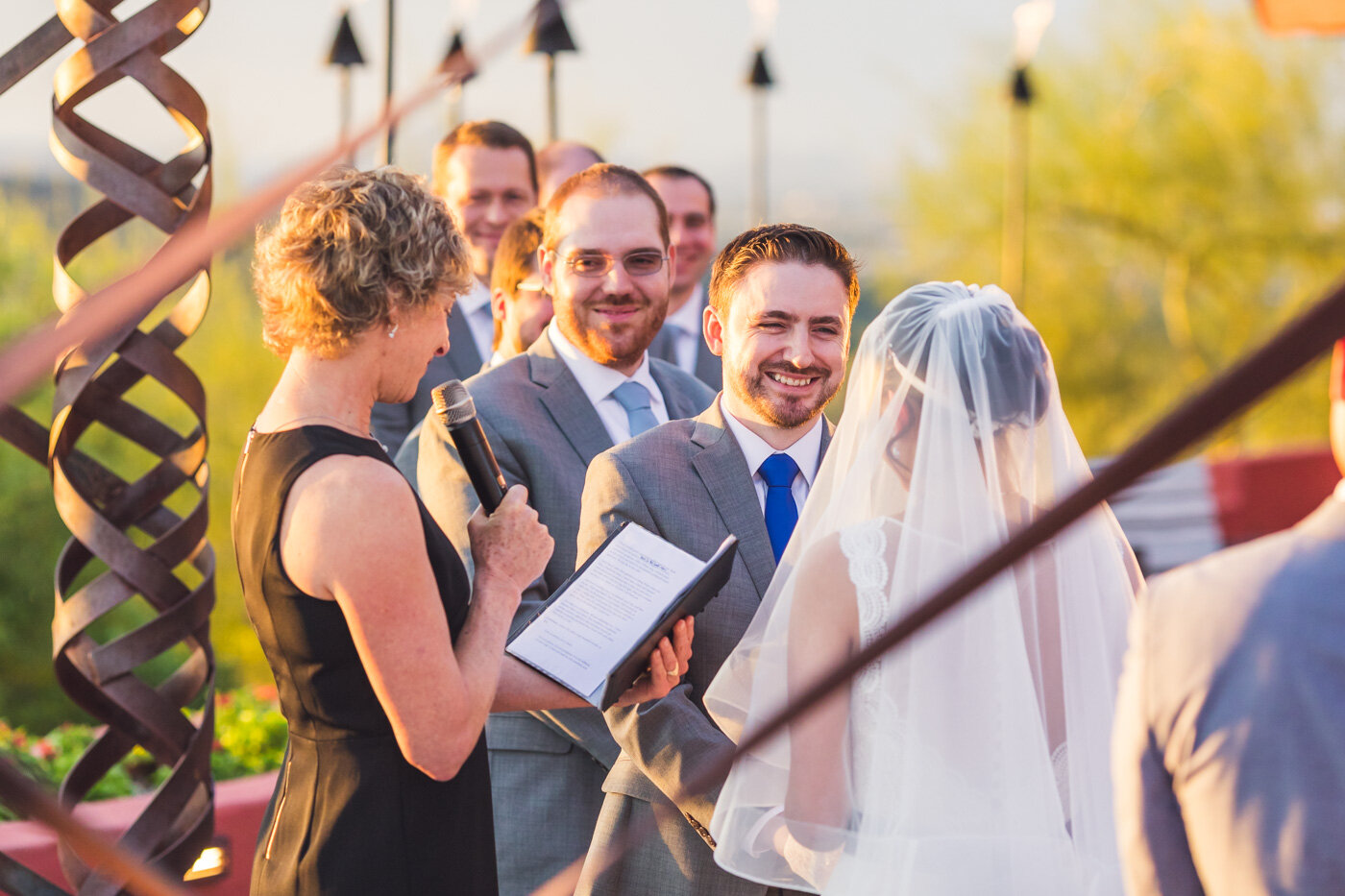 groom-laughing-during-wedding-ceremony
