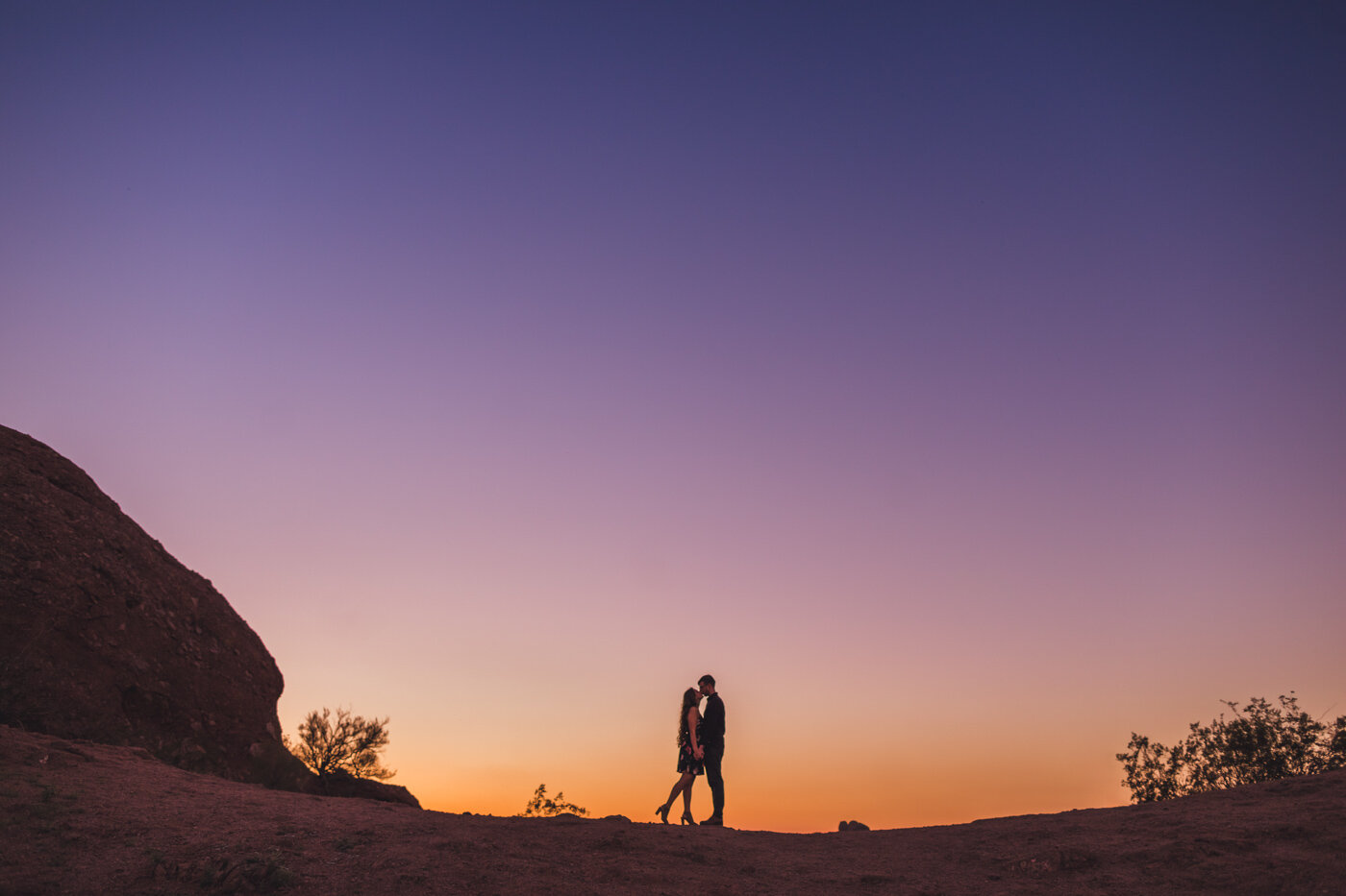 colorful-sunset-silhouette-engagement-photo