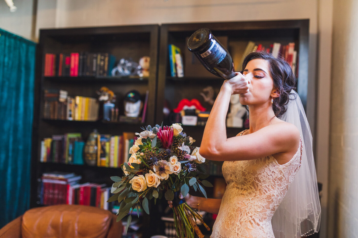 bride-drinking-champagne-from-bottle
