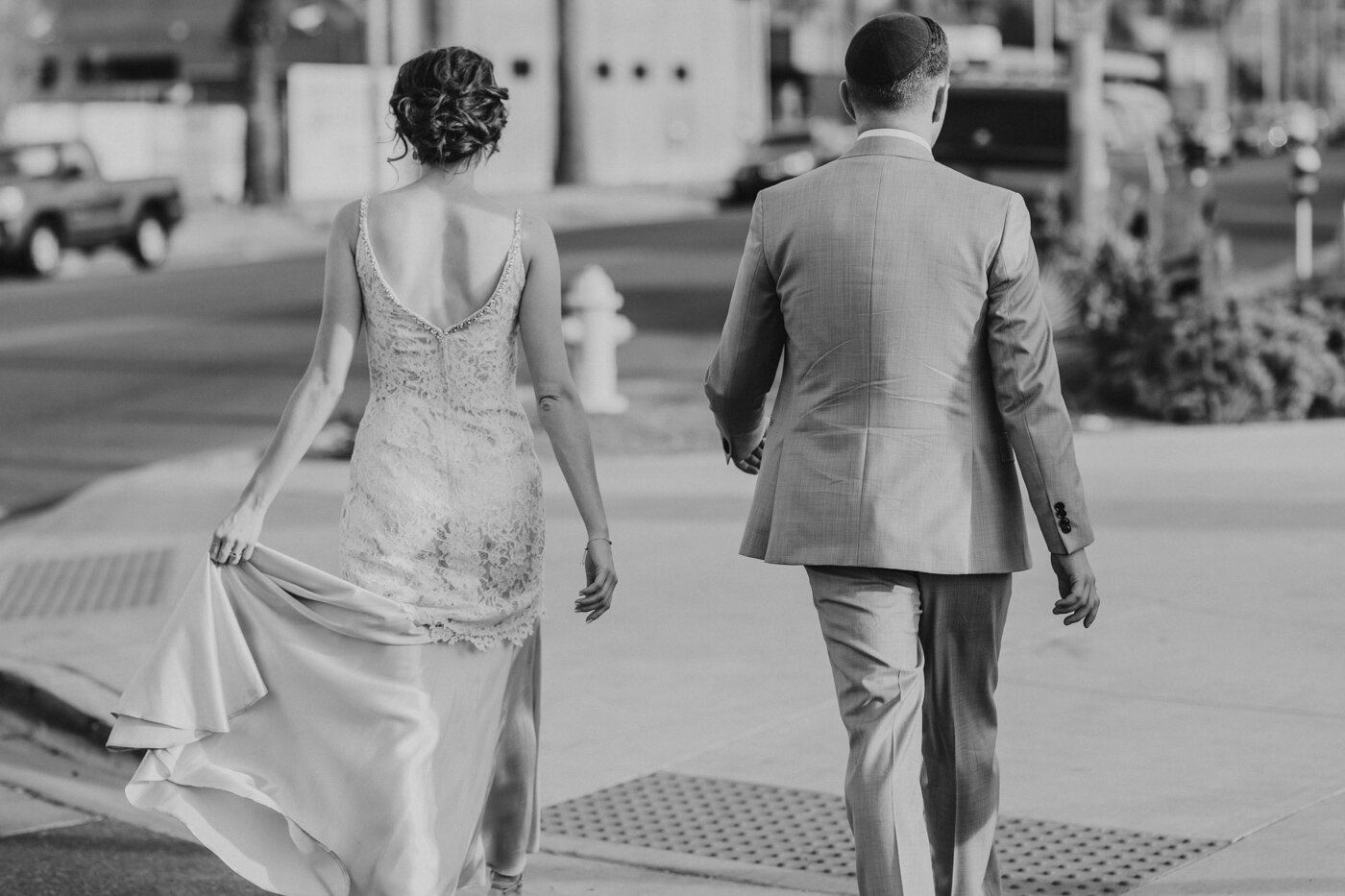 candid-black-and-white-walking-photo-bride-and-groom