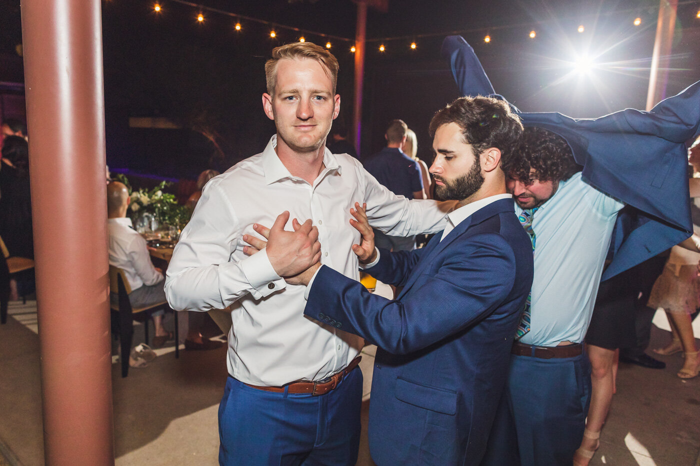 groom-having-fun-at-wedding-reception