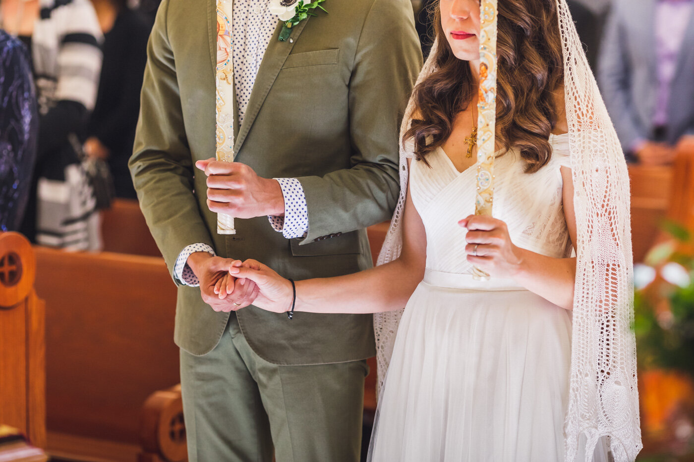 bride-and-groom-holding-hands-during-wedding-ceremony
