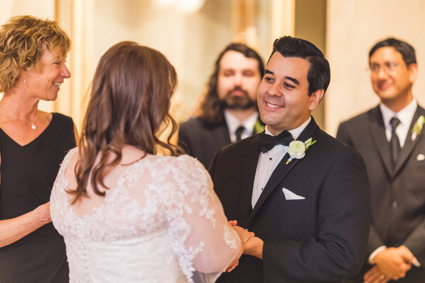 groom-smiling-at-bride