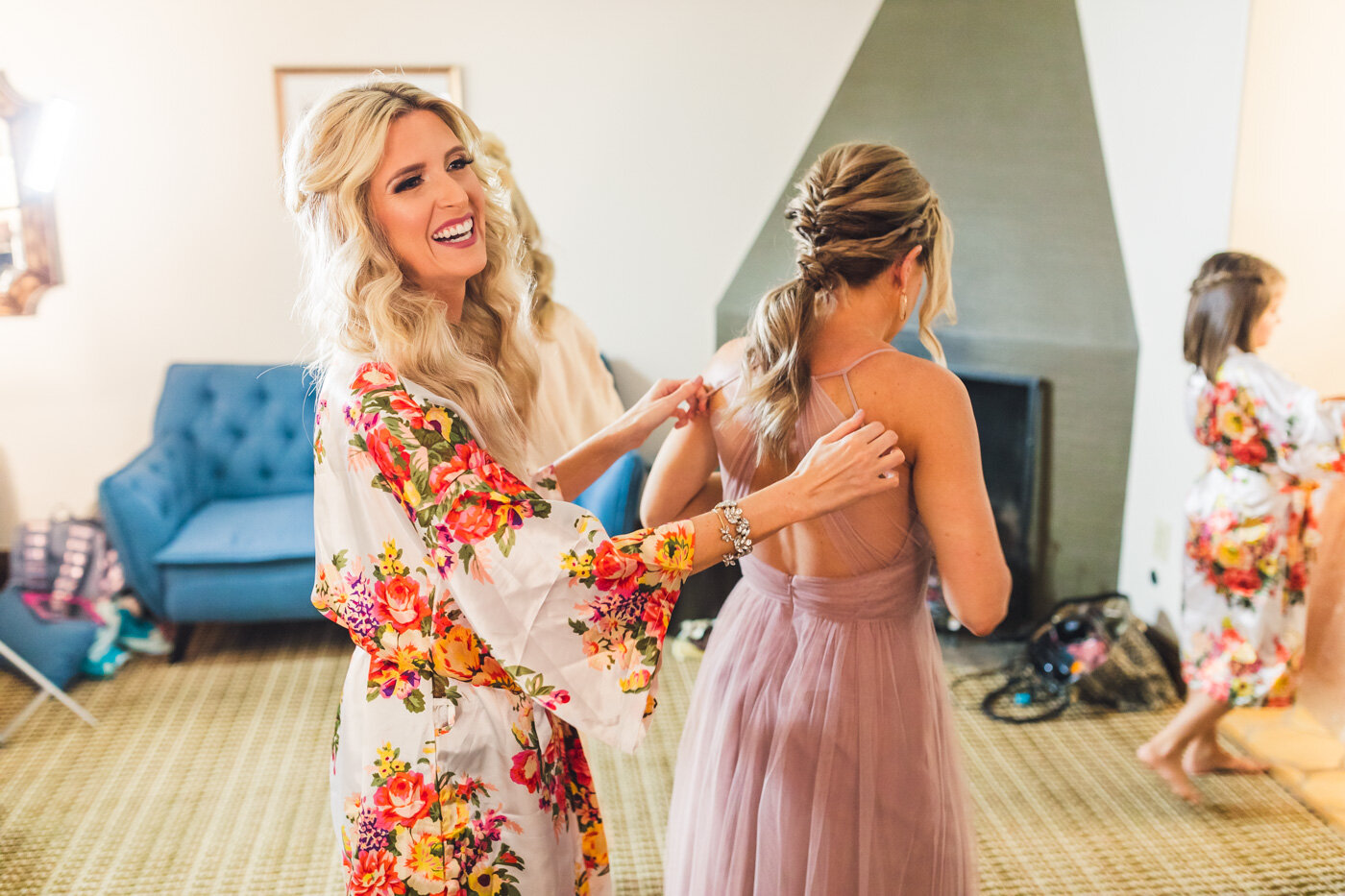 bride-helping-her-sister-get-ready