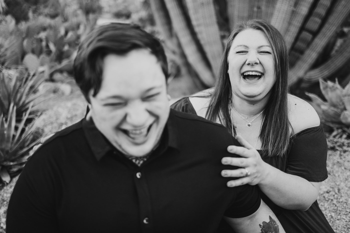 couple laughing in black and white
