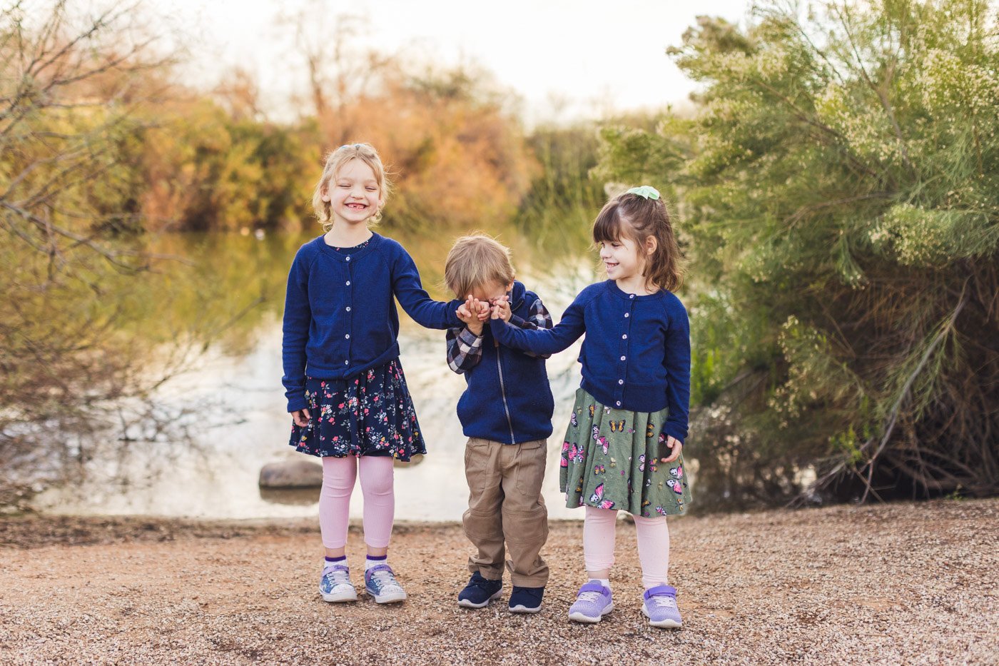 three kids laughing during photo session