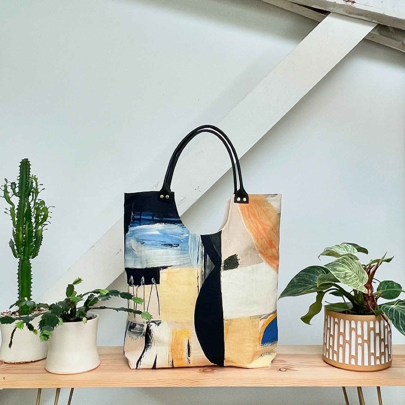 Still one of our best selling bags! Look sharp with the KAT TOTE in SOHO. Fabric designed in collaboration with fab PNW artist @micah_kassell 💛 Get ready to rock summer with this beauty. ☀️
