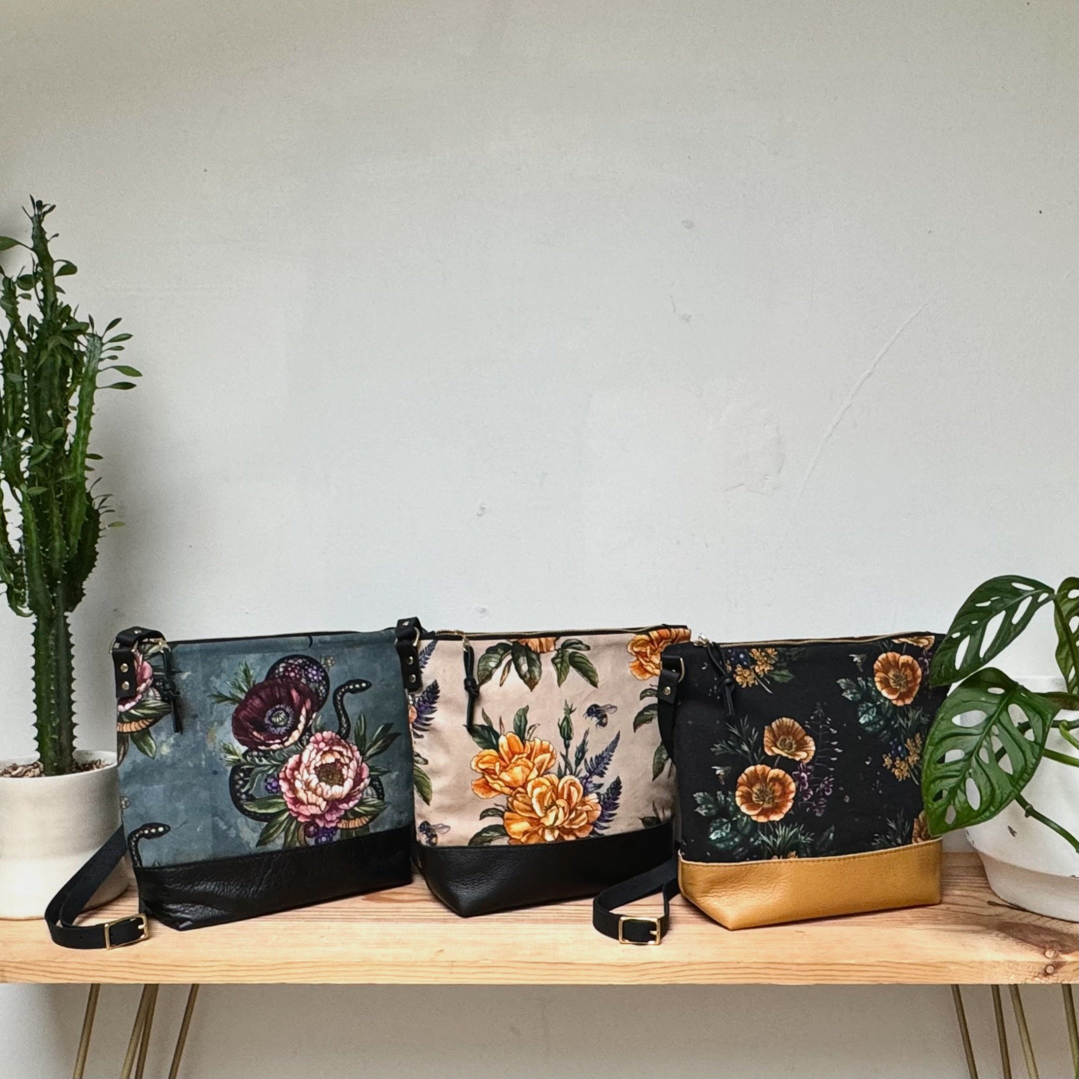 Finally! Our new bag style is here, the Coco Crossbody. Looking fabulous in the latest, gorgeous prints designed by @alicestattoos 💛 Yellow Rose with Fern &amp; Bee 🐝  Snake with Peony, Poppy and Berries 🫐 California Poppy with Alaskan Fireweed, O