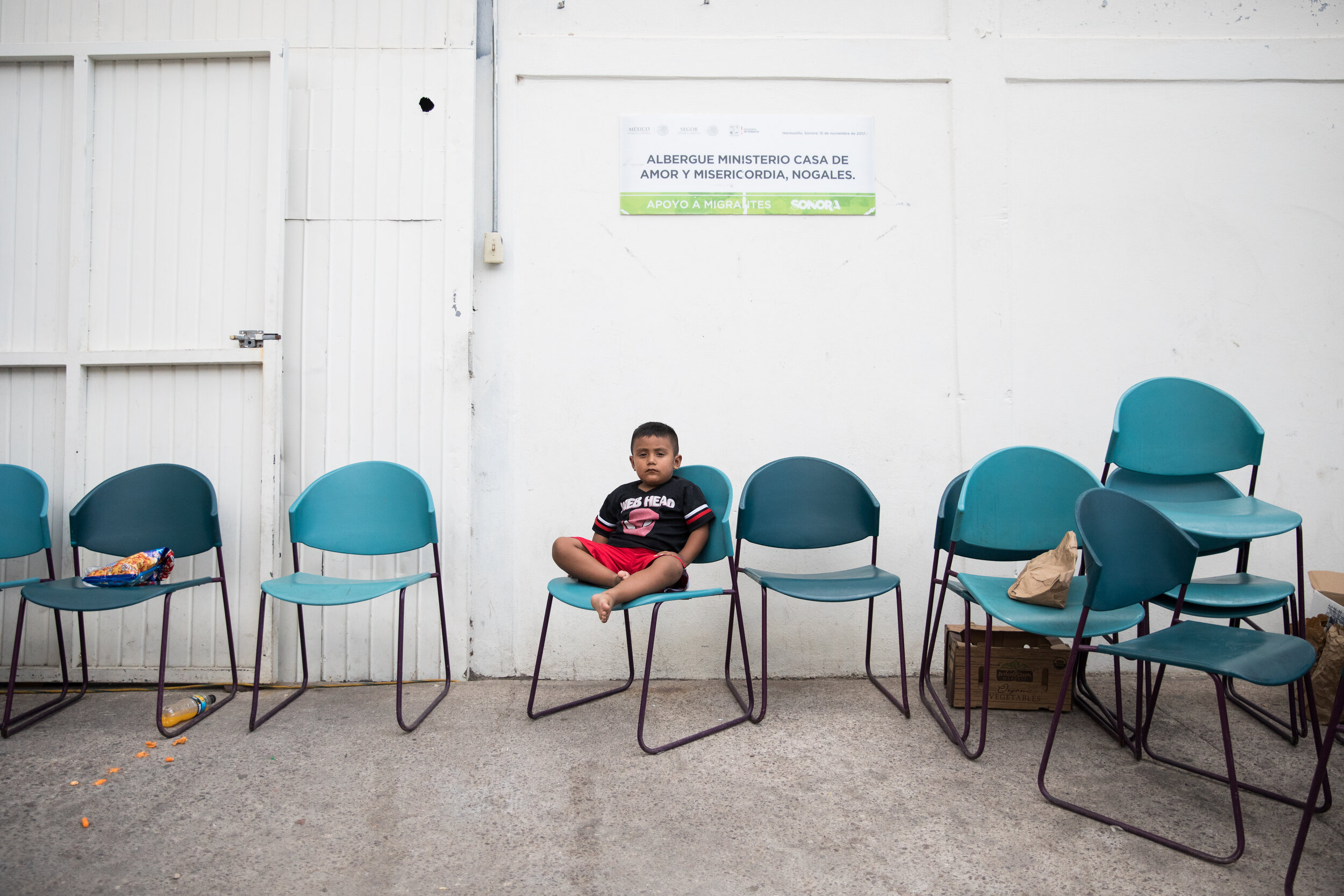  Urmaro, 4 sits outside Albergue Ministerio Casa de Amor y Misericordia in Nogales where hundreds of people who have traveled from their home countries in Central America escaping violence and dire living conditions are seeking shelter while they wai