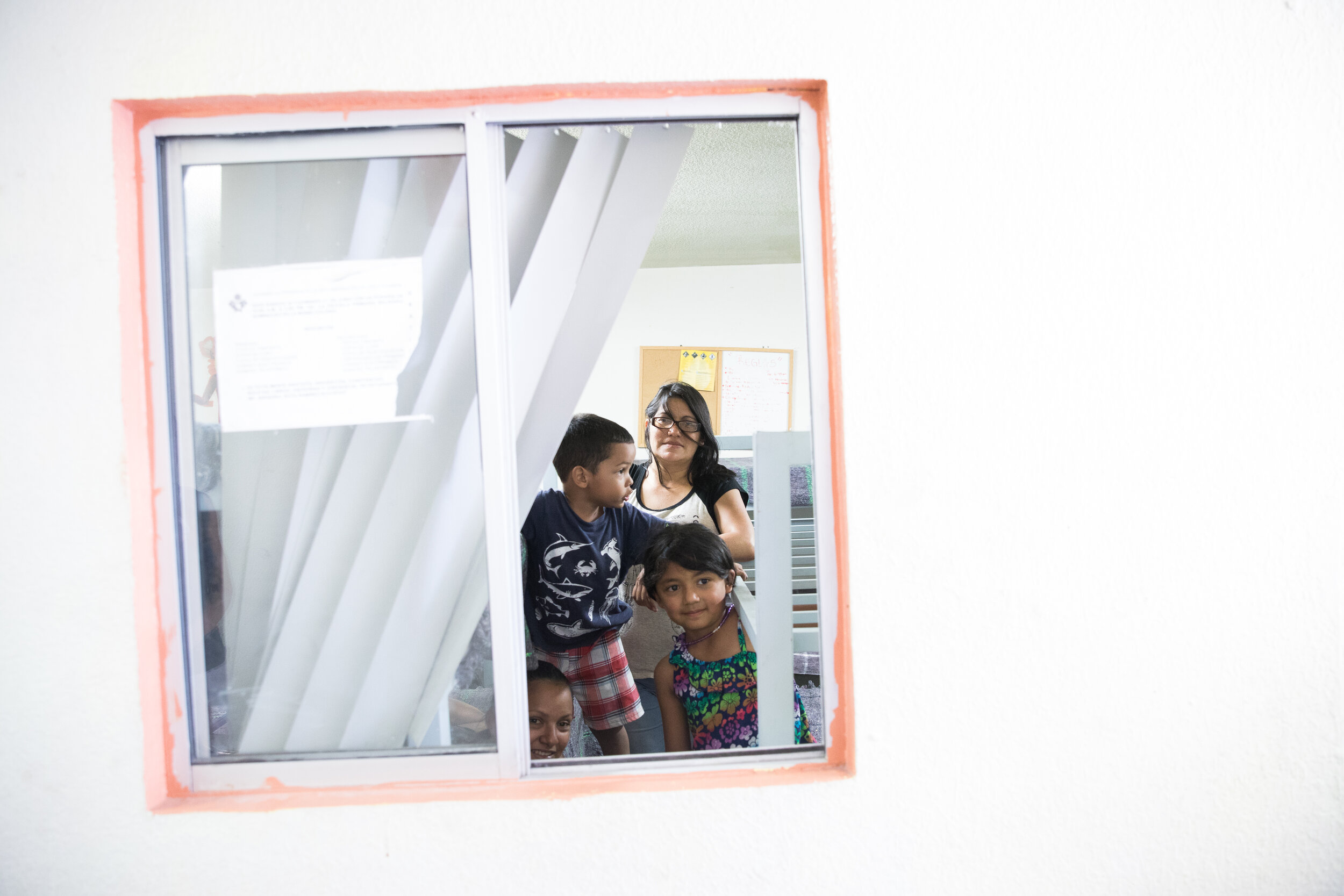  Sonia Fuentes 43, with her daughter Gisela and Heidi Guzman 27 and her son Eduardo at Albergue Ministerio Casa de Amor y Misericordia, a shelter housing migrants in Nogales.  