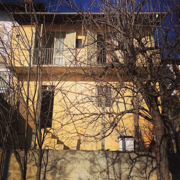 The living space is upstairs, and the cellar opens up to a terrace which leads down to a small lower garden. It's attached to other houses on both sides. 