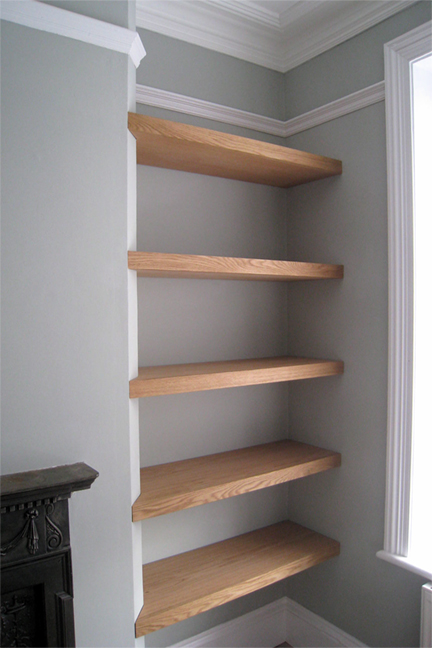 bespoke joinery crafted shelving fitted to alcove