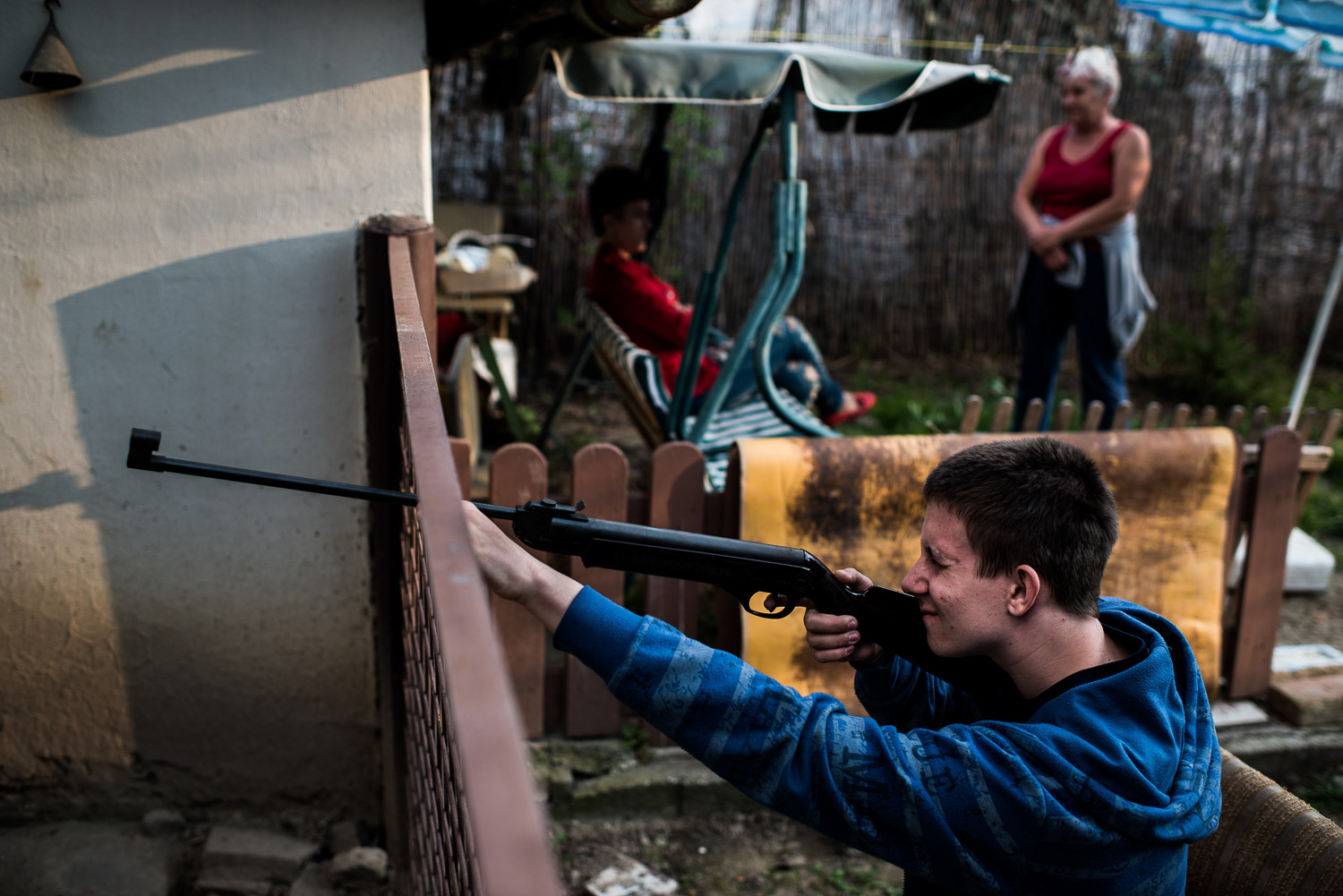 A Hungarian youth practicing with an air gun. Whoever has the means looks for a job elsewhere in the country and only comes to visit the family on holidays.